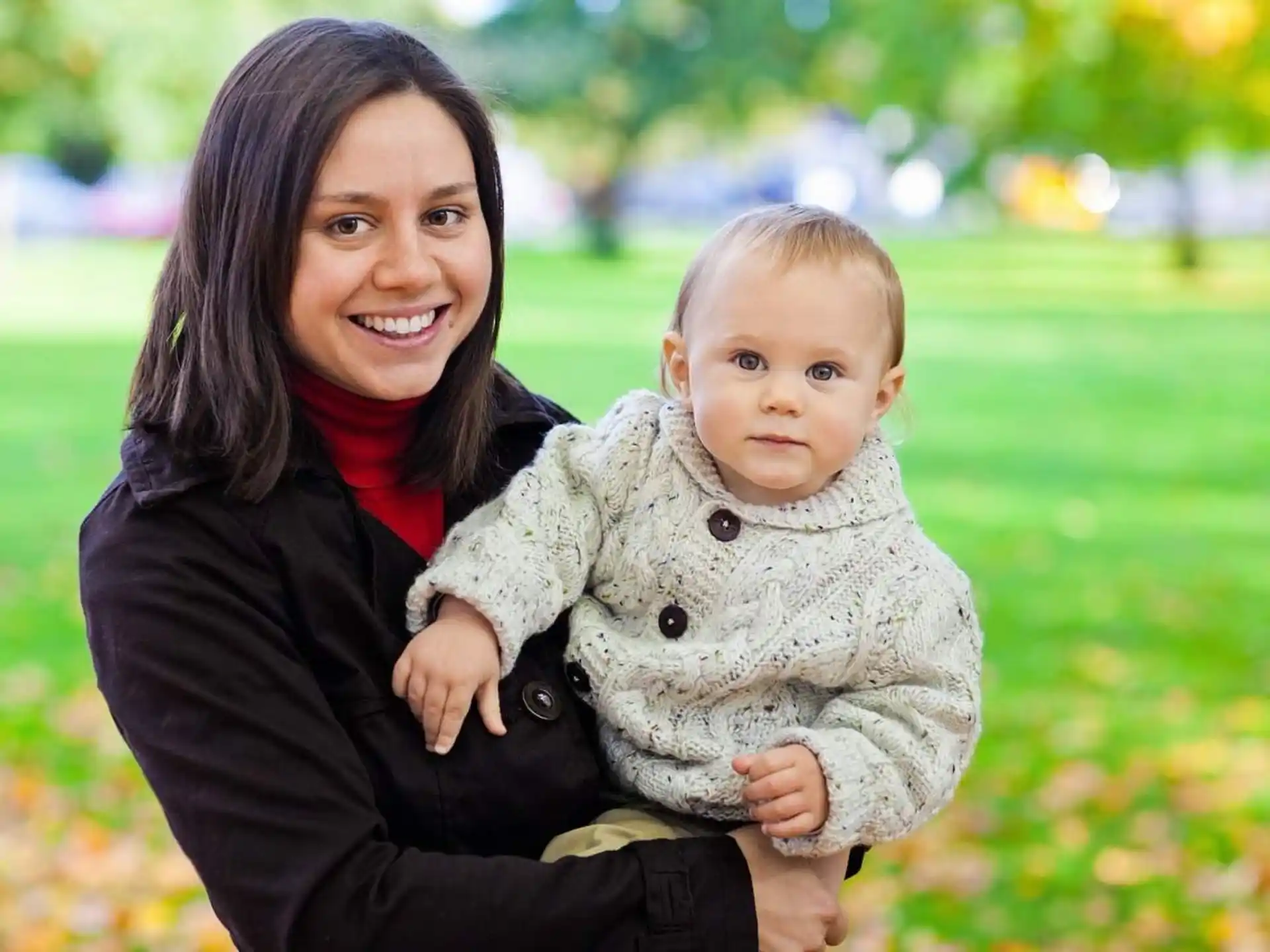 a person holding a baby