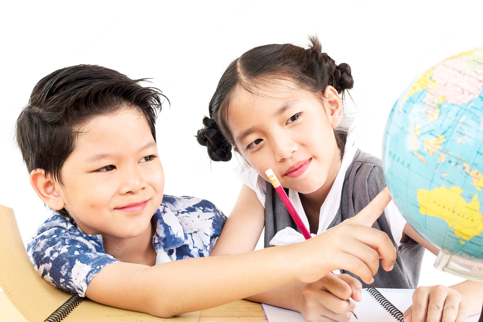 a couple of children looking at a globe