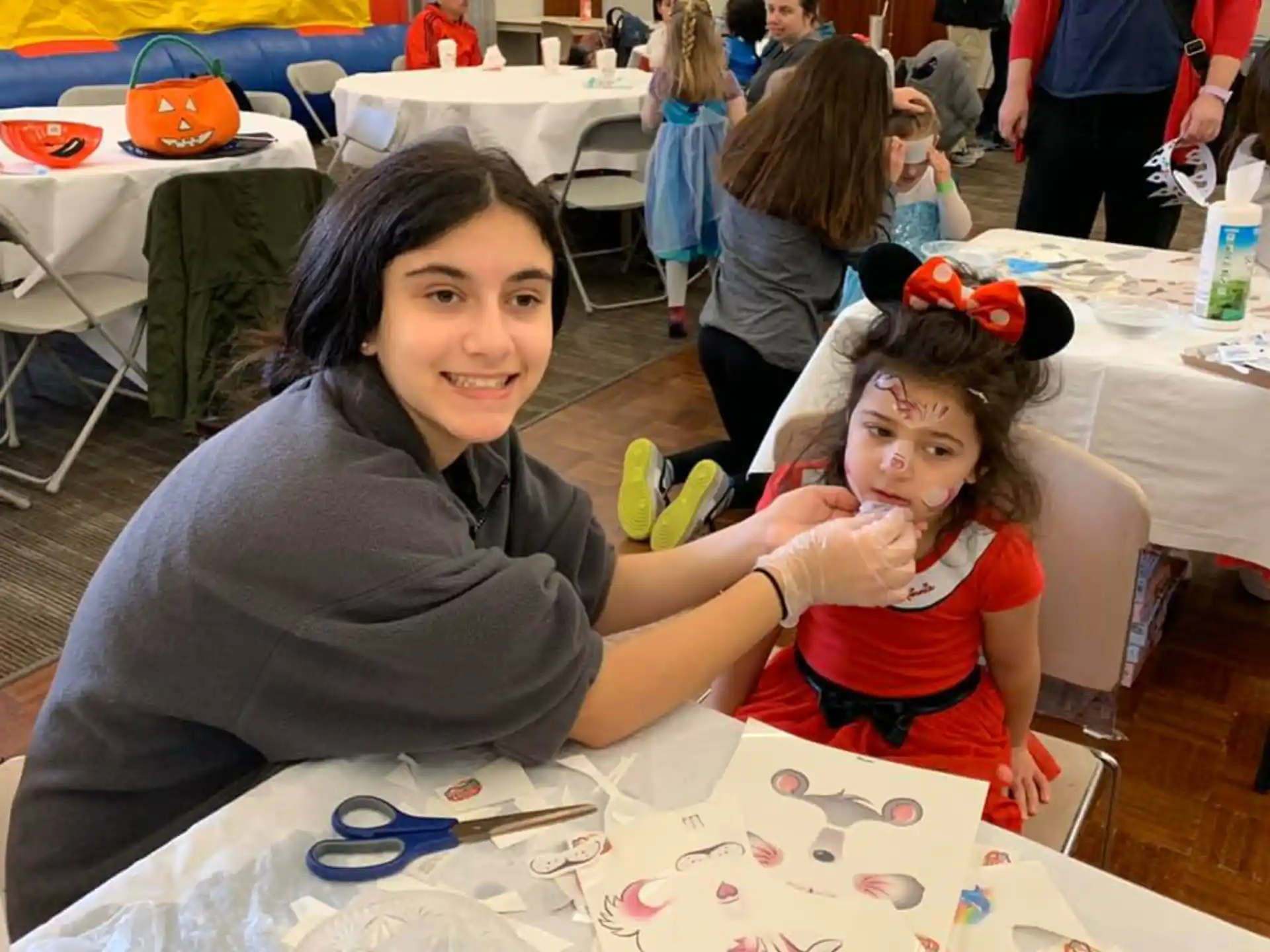 a person and a child sitting at a table