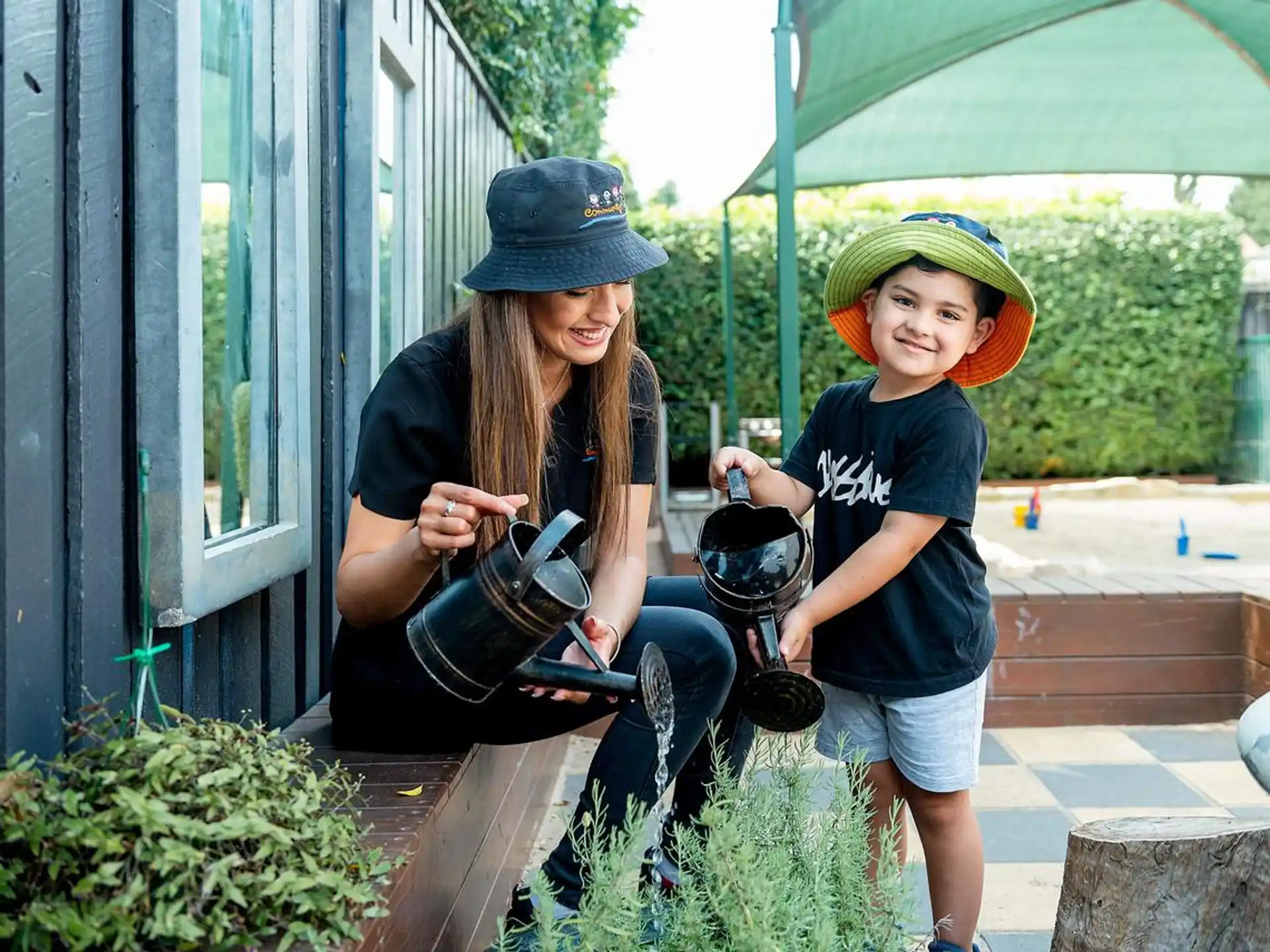 a person and a child holding a camera