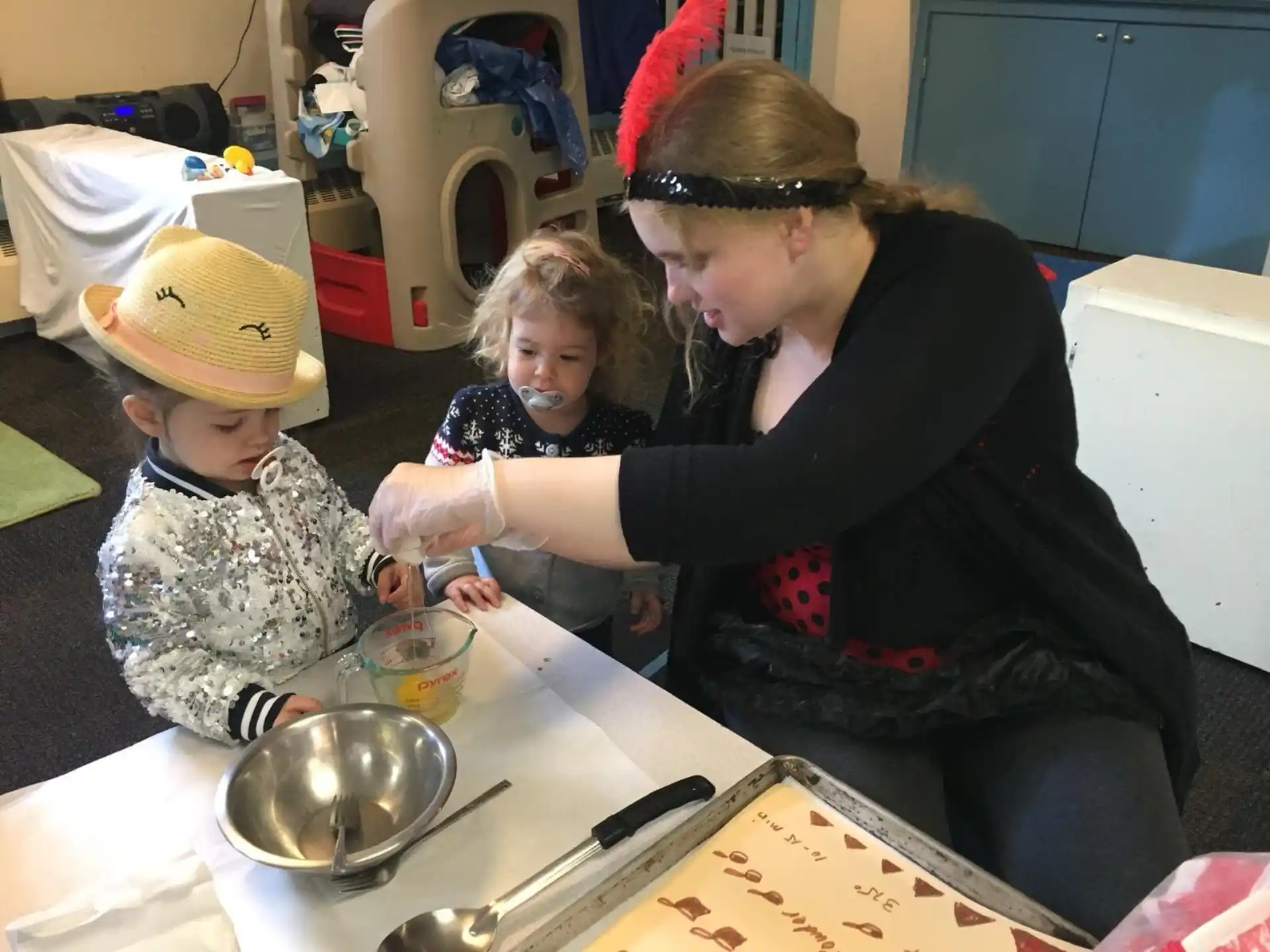 a person and a couple of kids wearing clothing