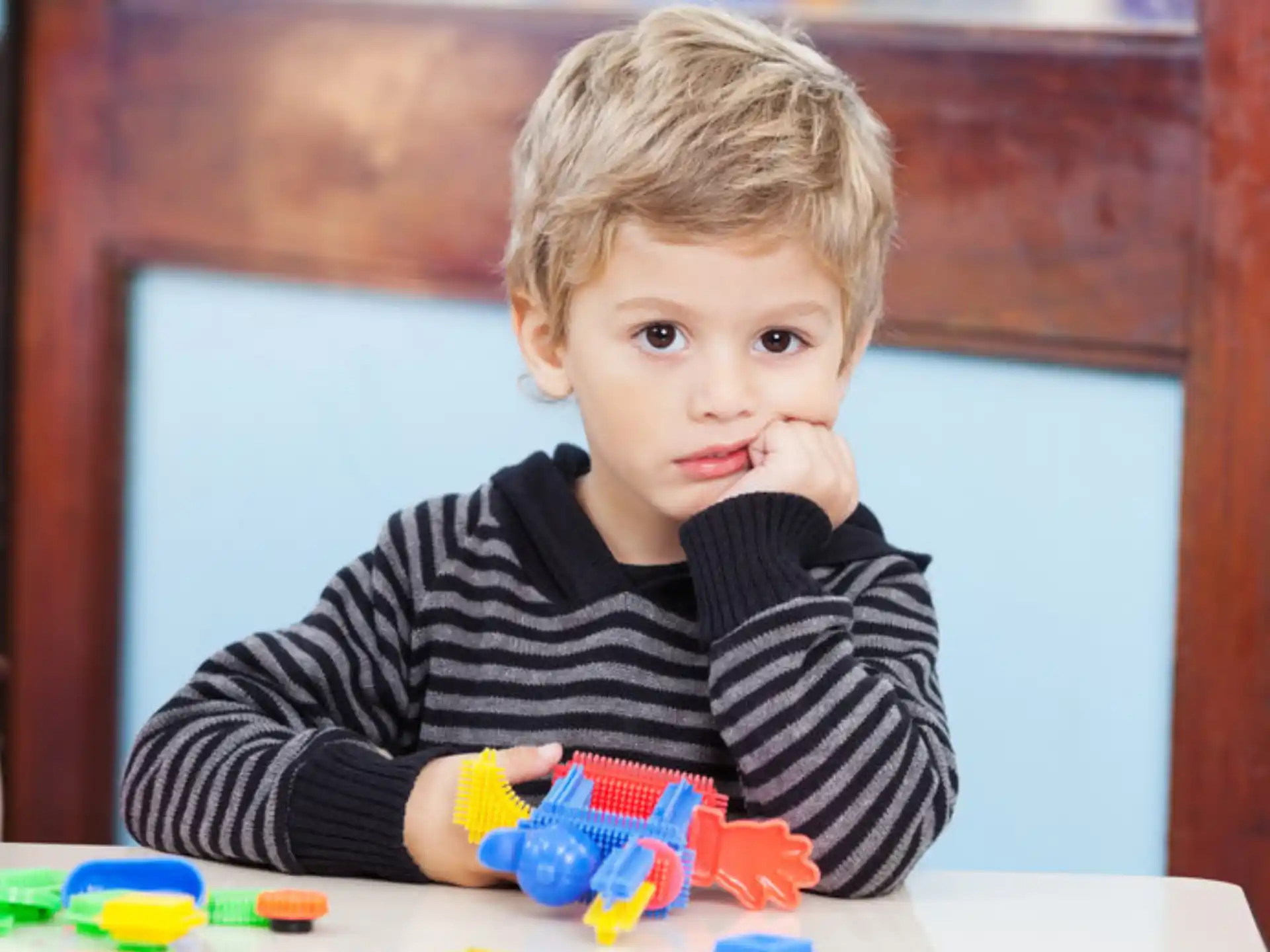 a child sitting at a table