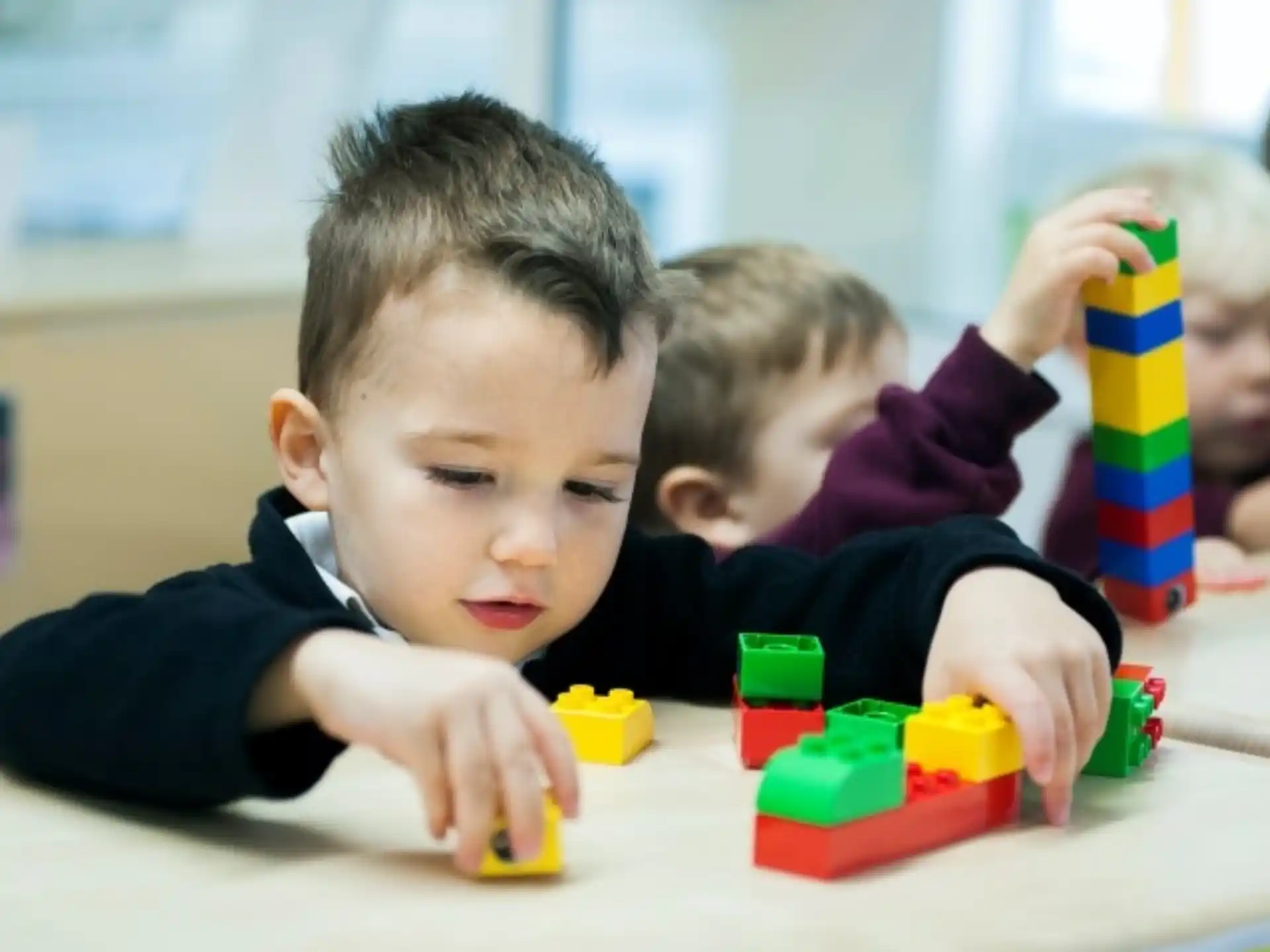 a few children playing with toys