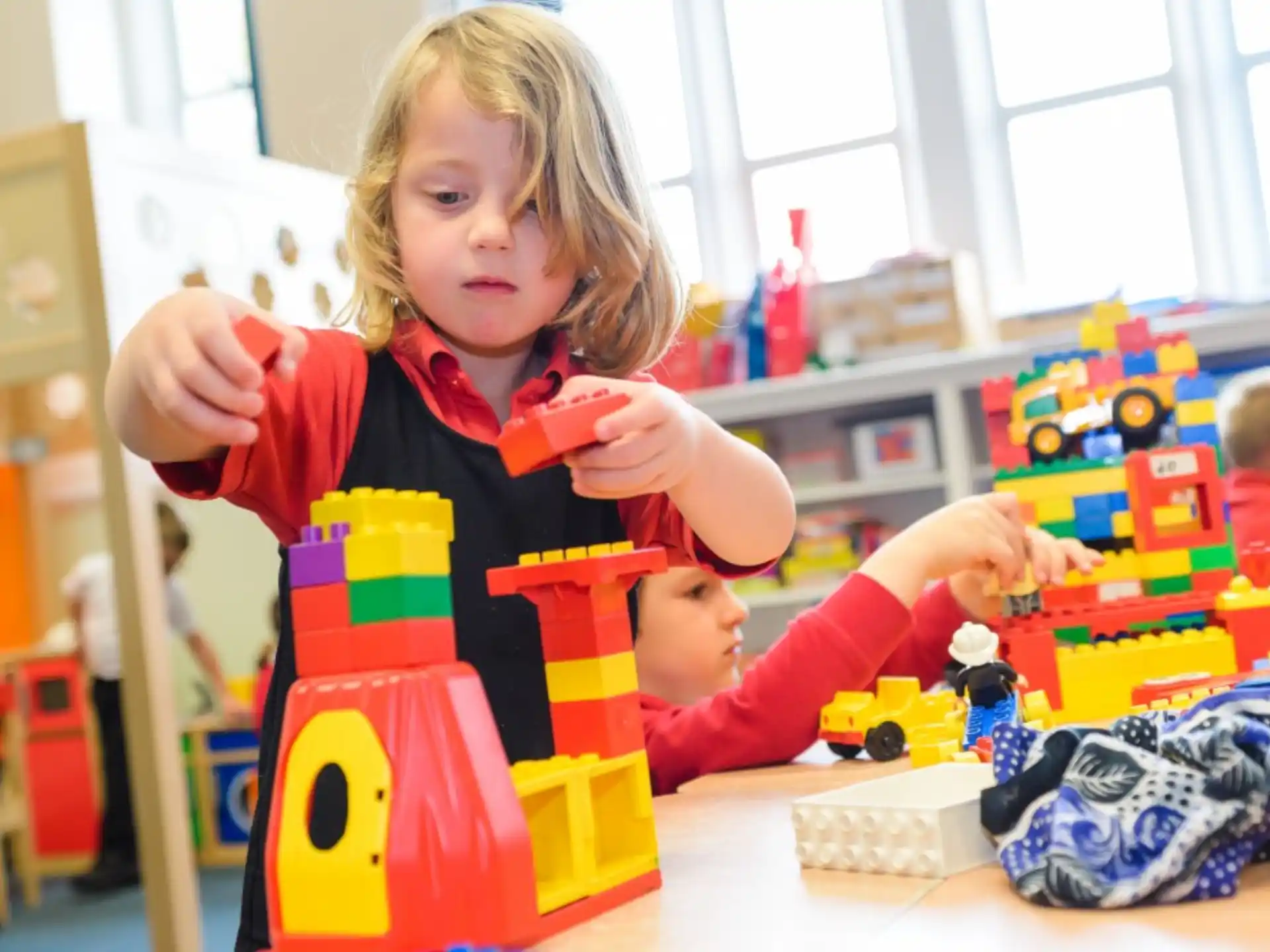 a young girl playing with toys