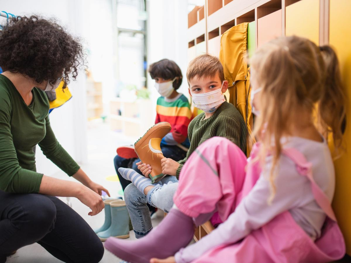 a group of children wearing face masks