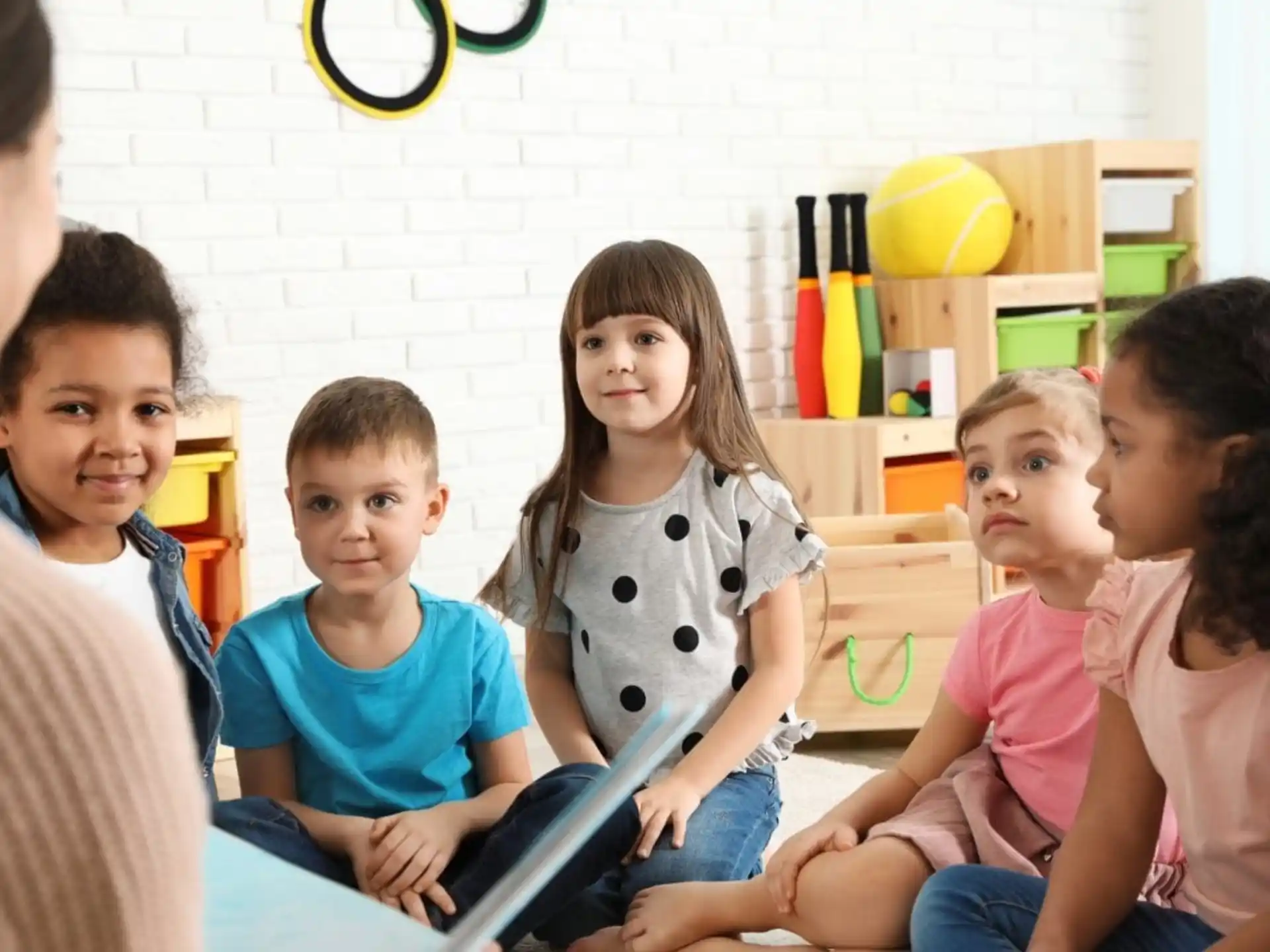 a group of children sitting on the floor