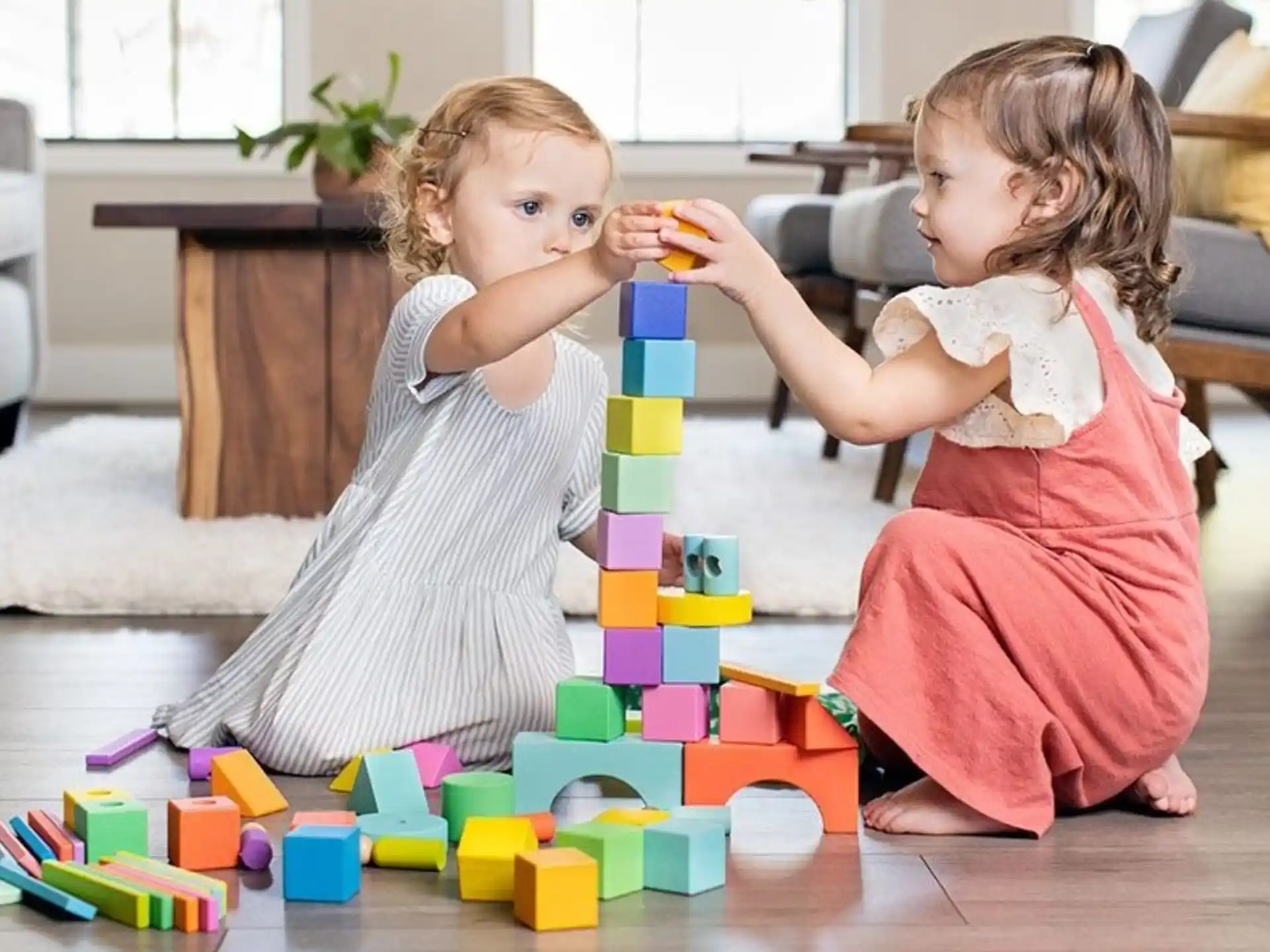 a couple of children playing with toys