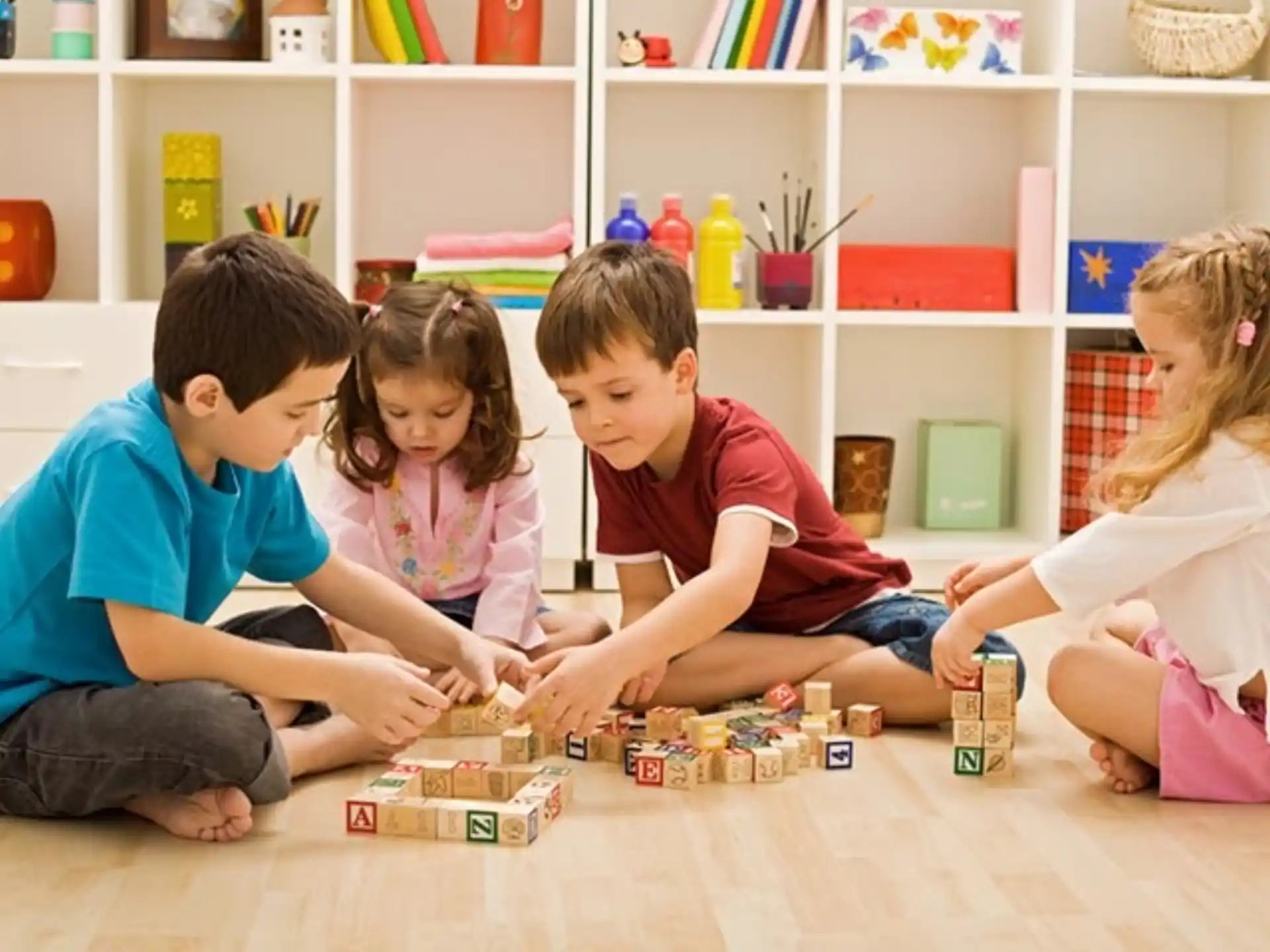 a group of children playing with toys