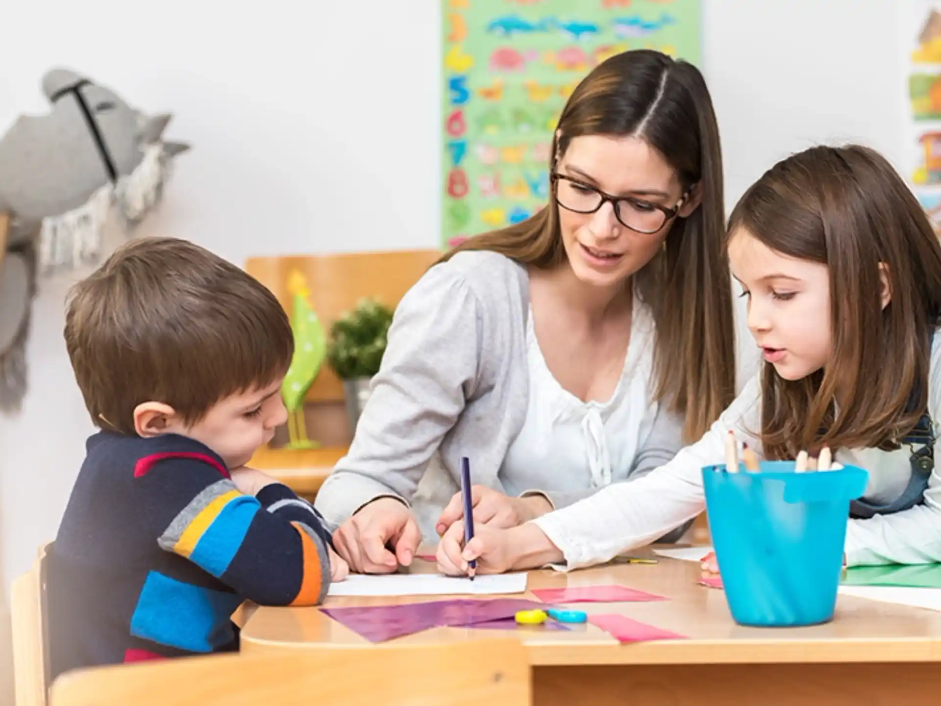a person and a child sitting at a table