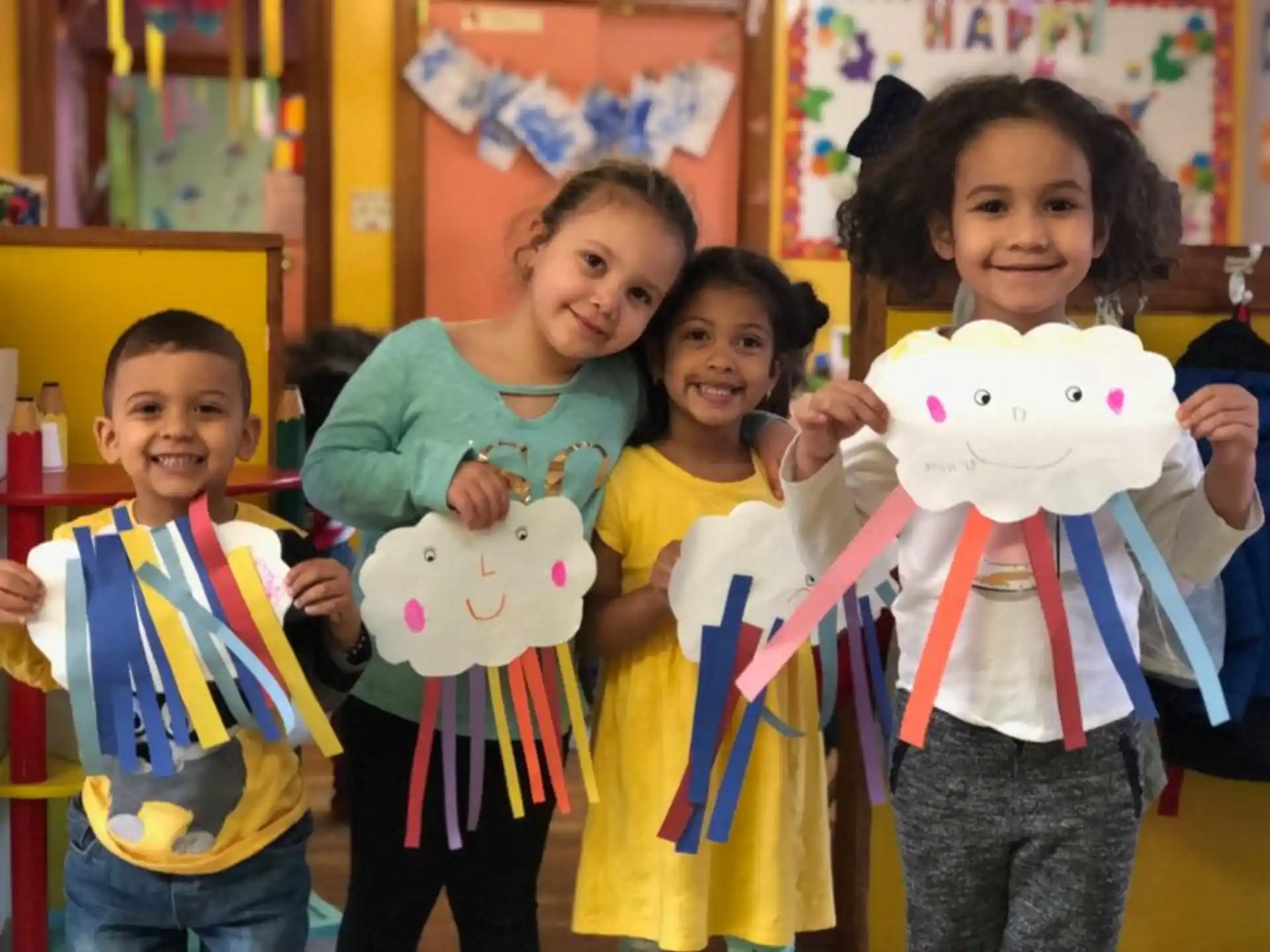 a group of children holding stuffed animals