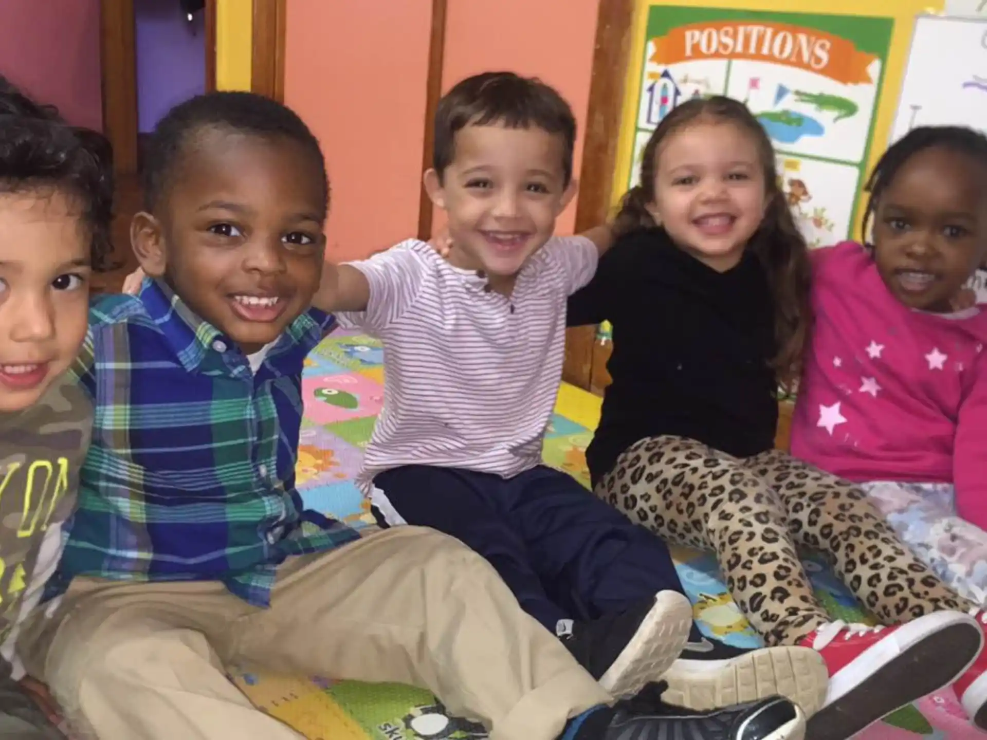 a group of children sitting on a couch
