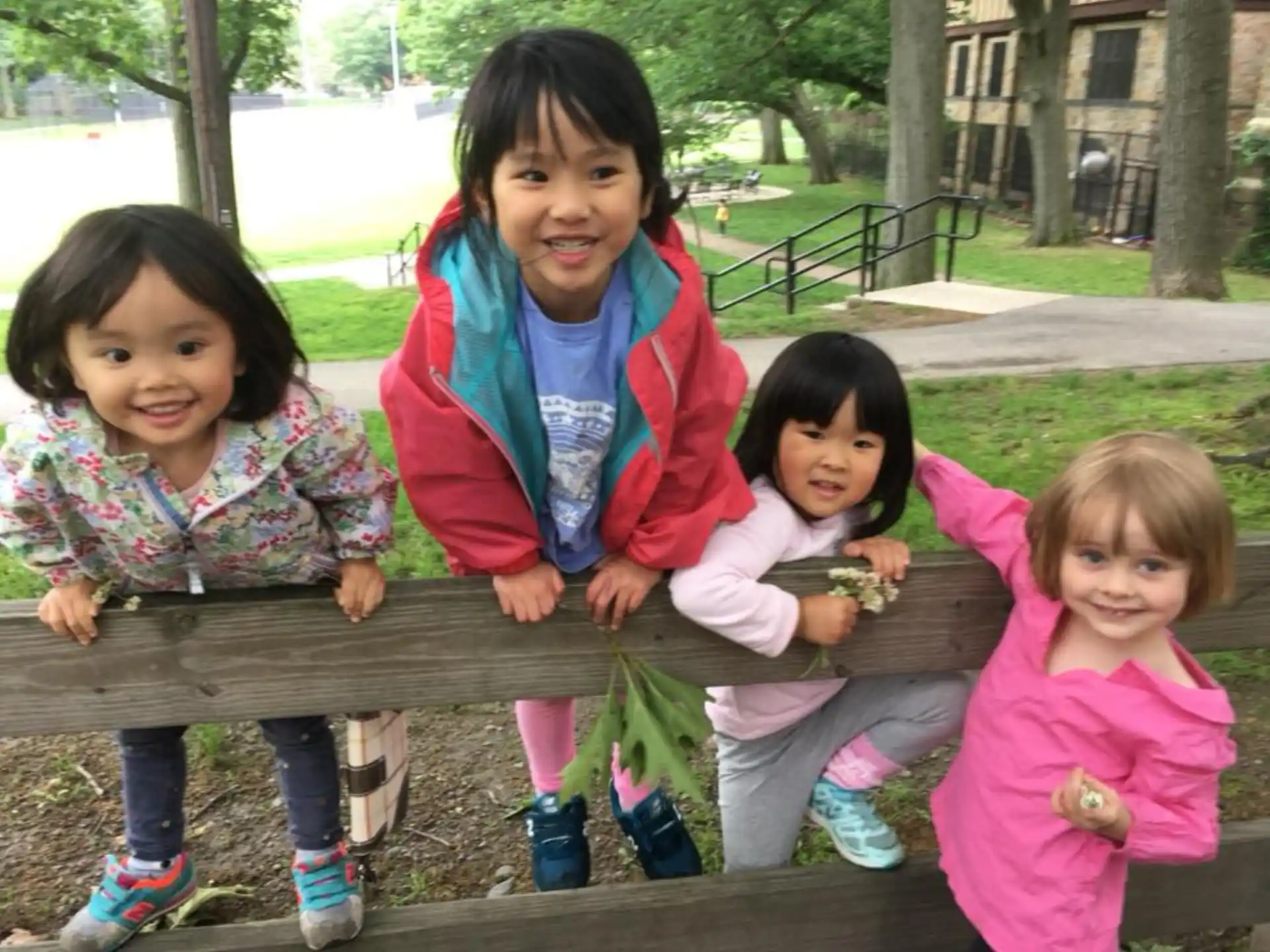 a group of children sitting on a bench
