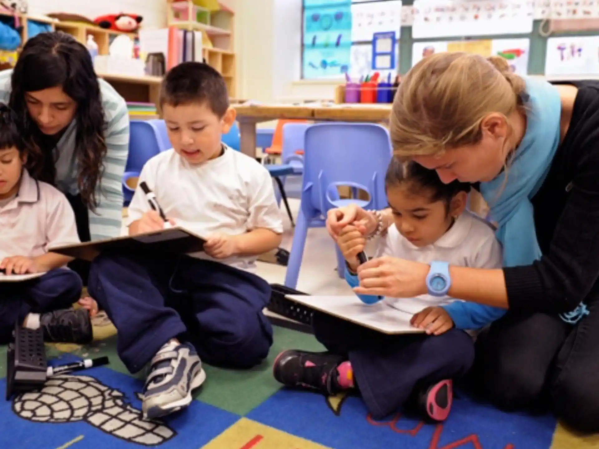 a person and several children sitting on the floor