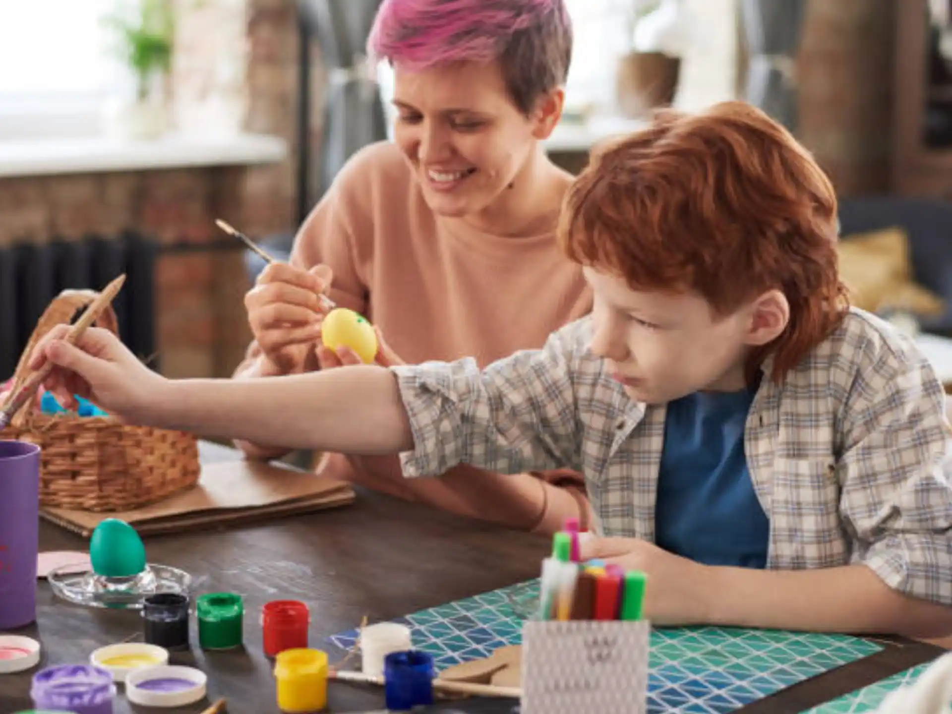 a person and a boy painting