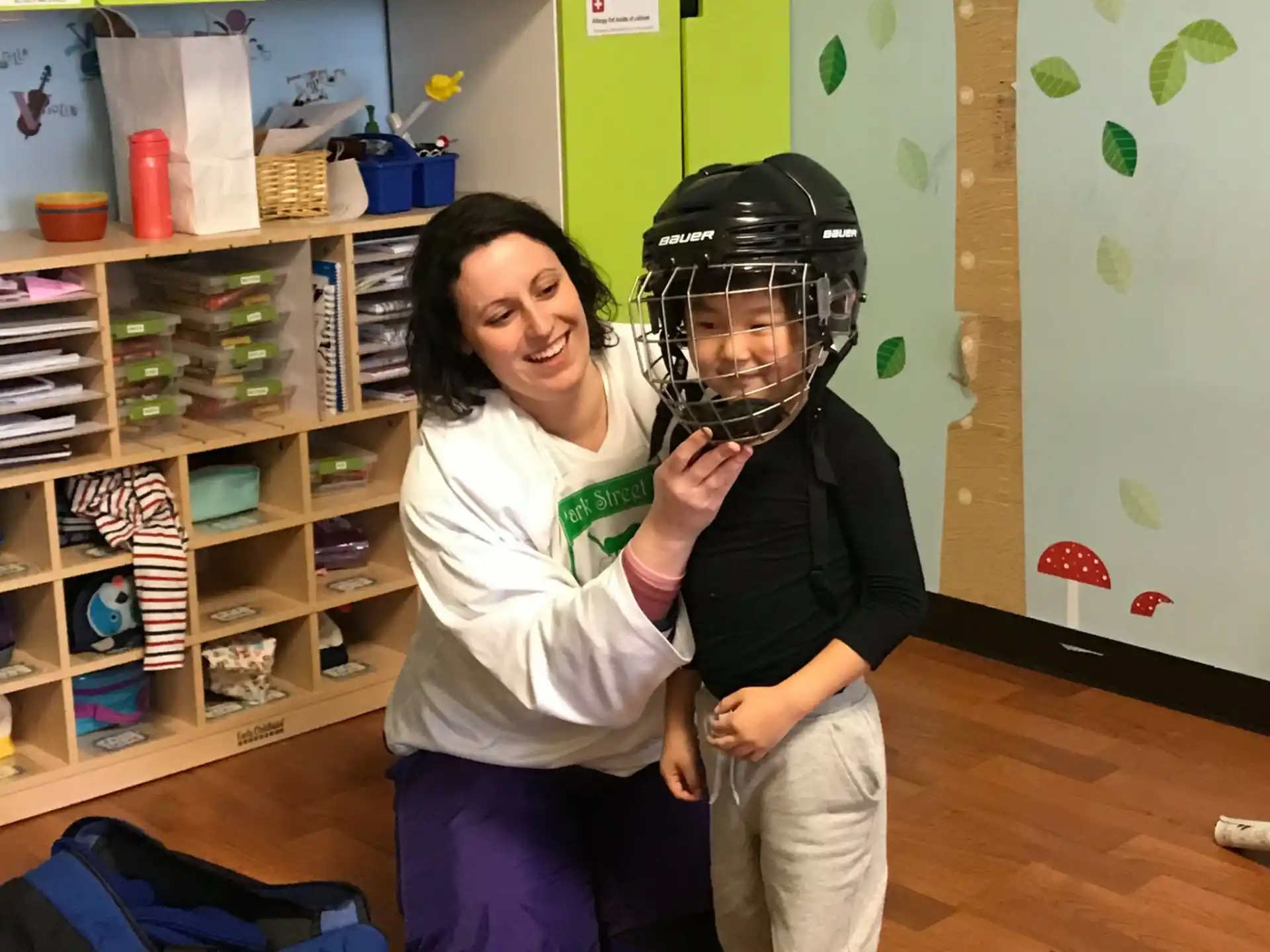 a woman holding a man in a helmet