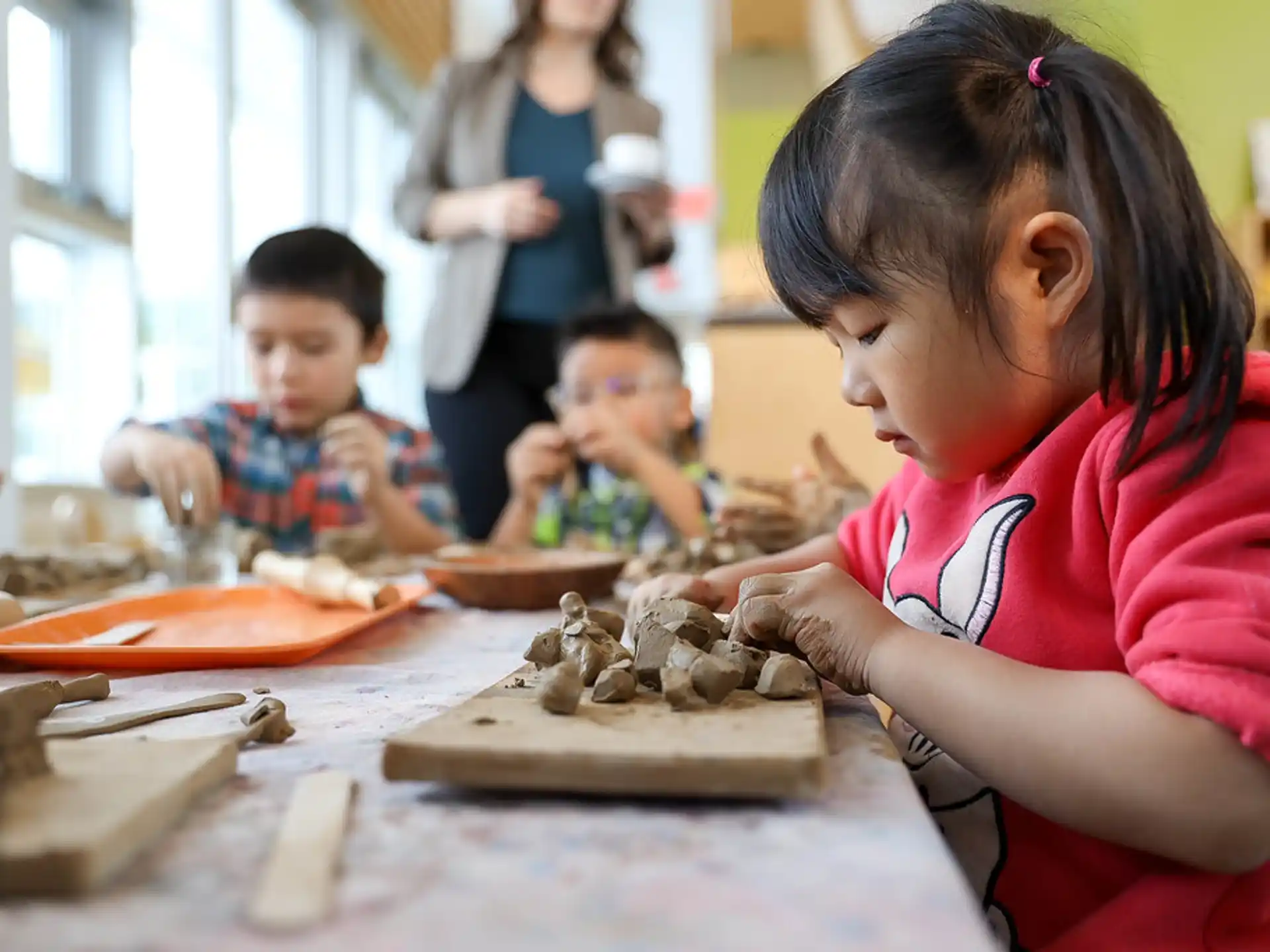 a group of children playing with sand
