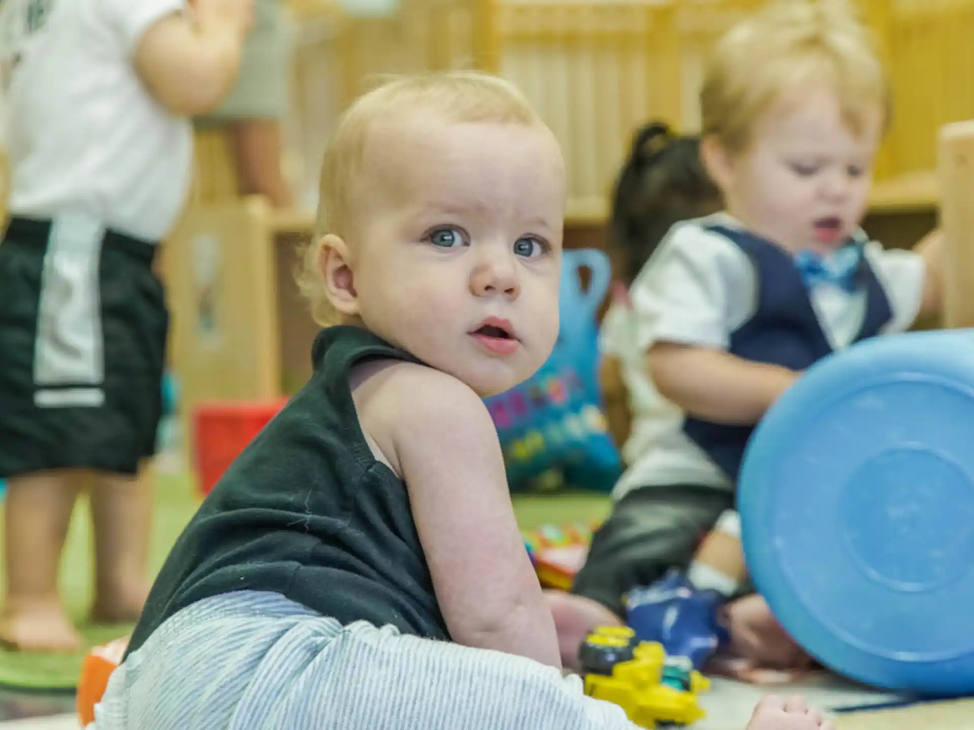 a group of children playing with toys