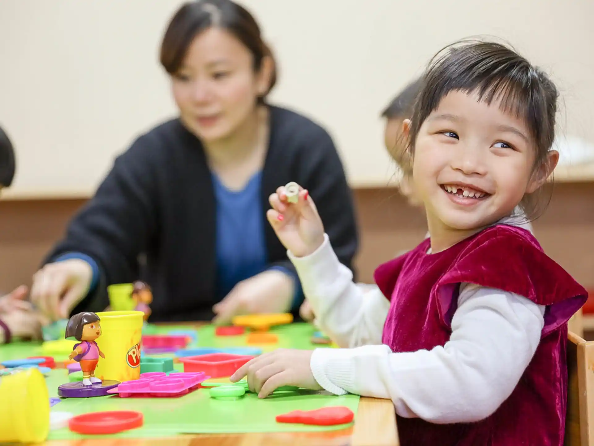 a person and a child painting