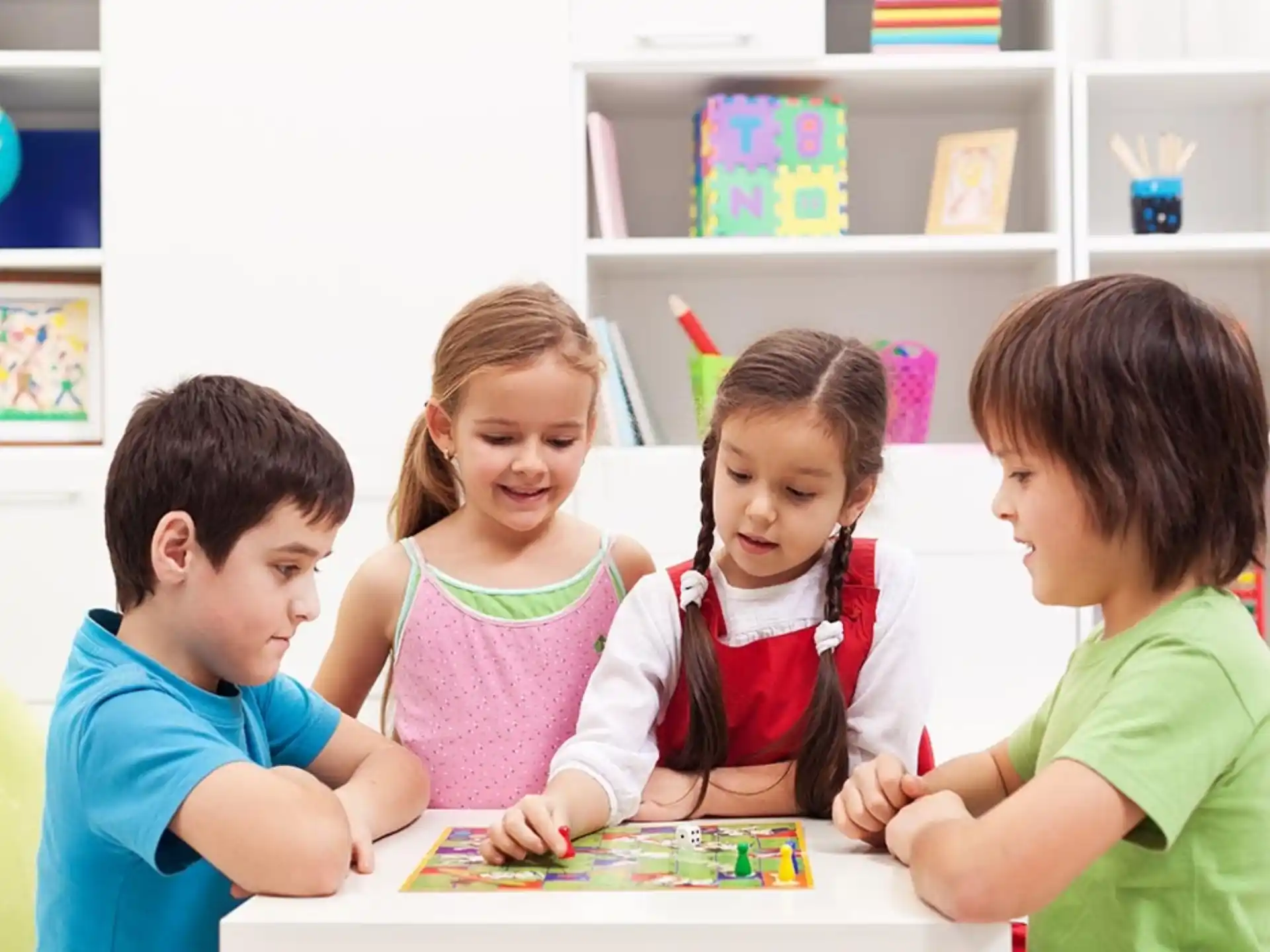 a group of children sitting at a table