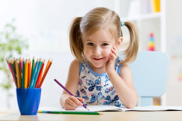 a girl sitting at a table