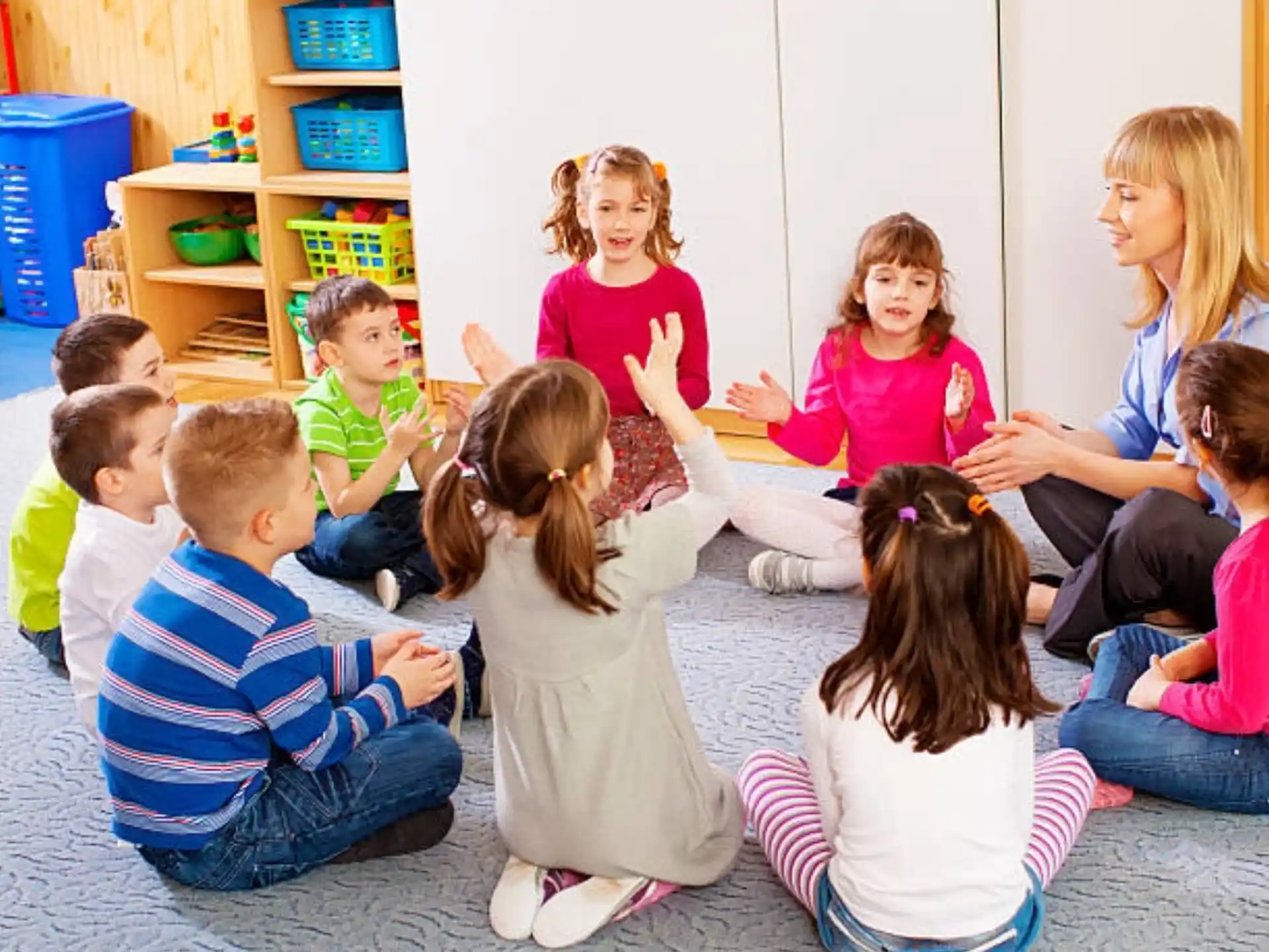 a group of children sitting on the floor