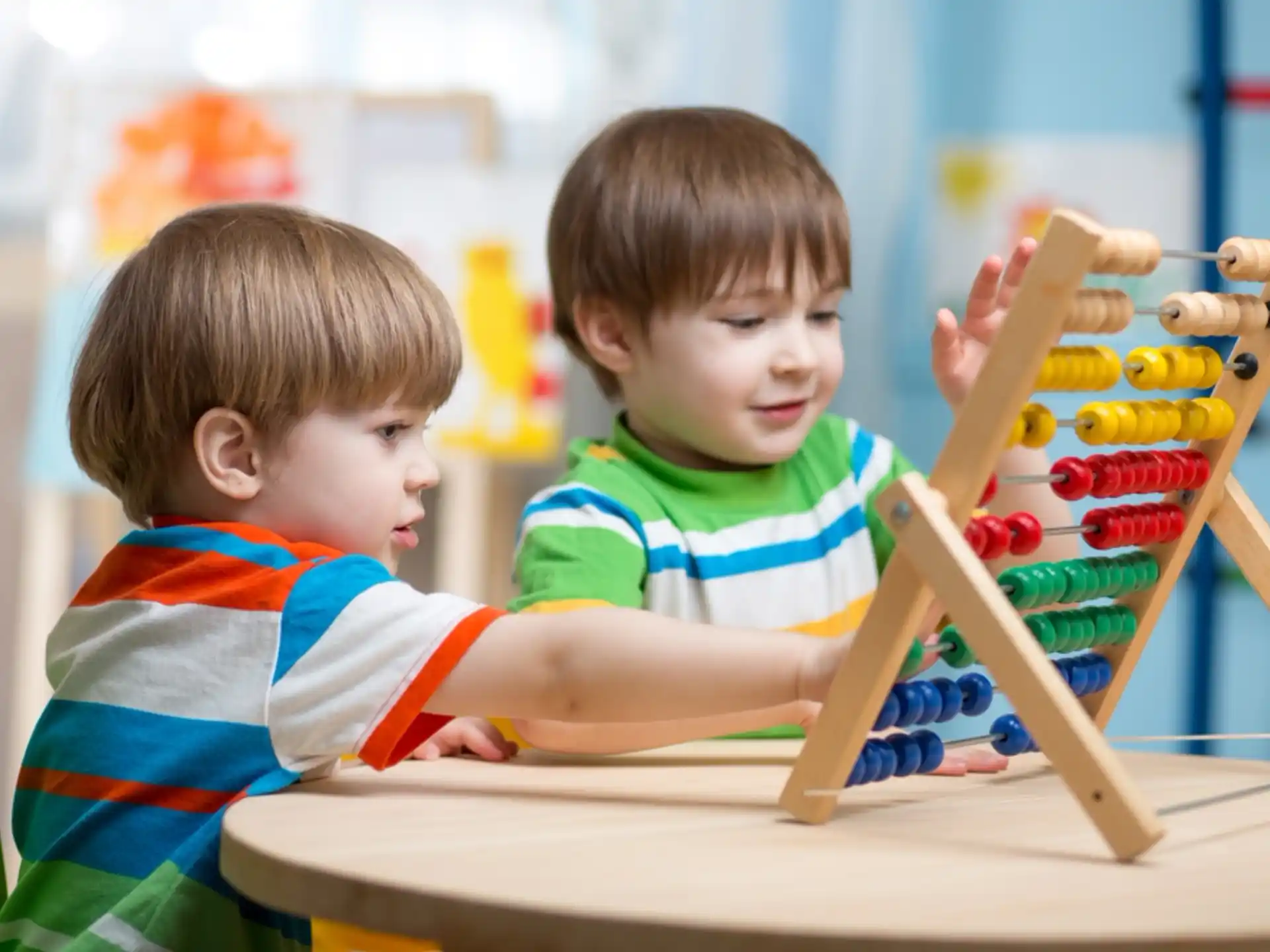 two boys playing with toys