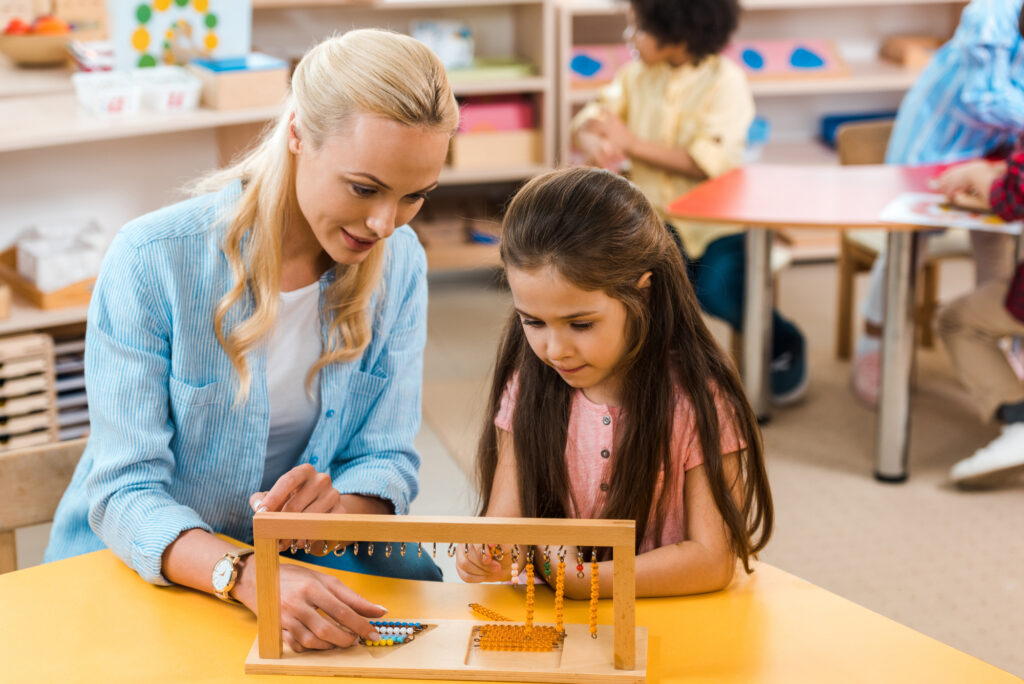 a teacher helping a student with a pencil