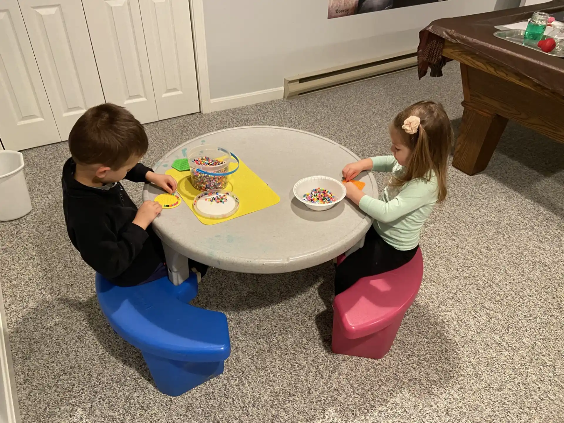 a couple of children playing with toys