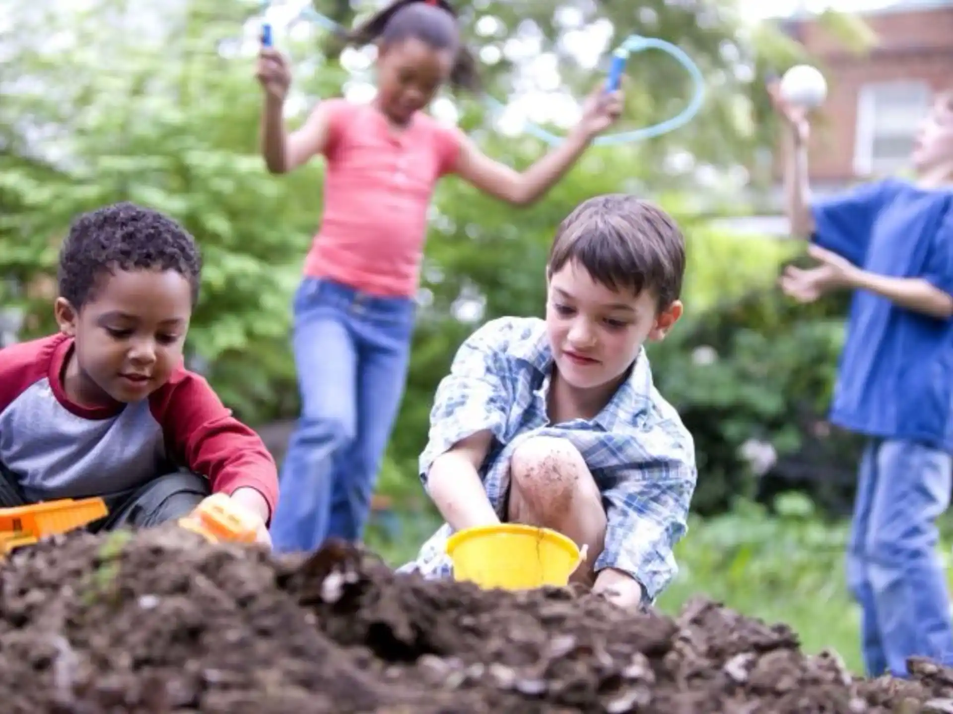 children playing in the mud