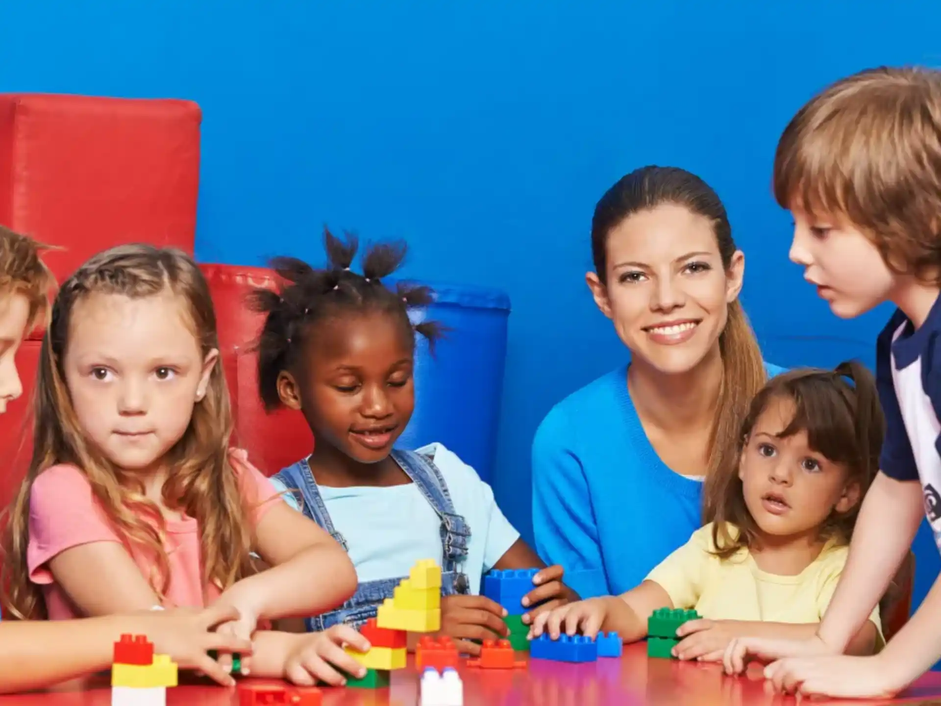 a group of children sitting at a table