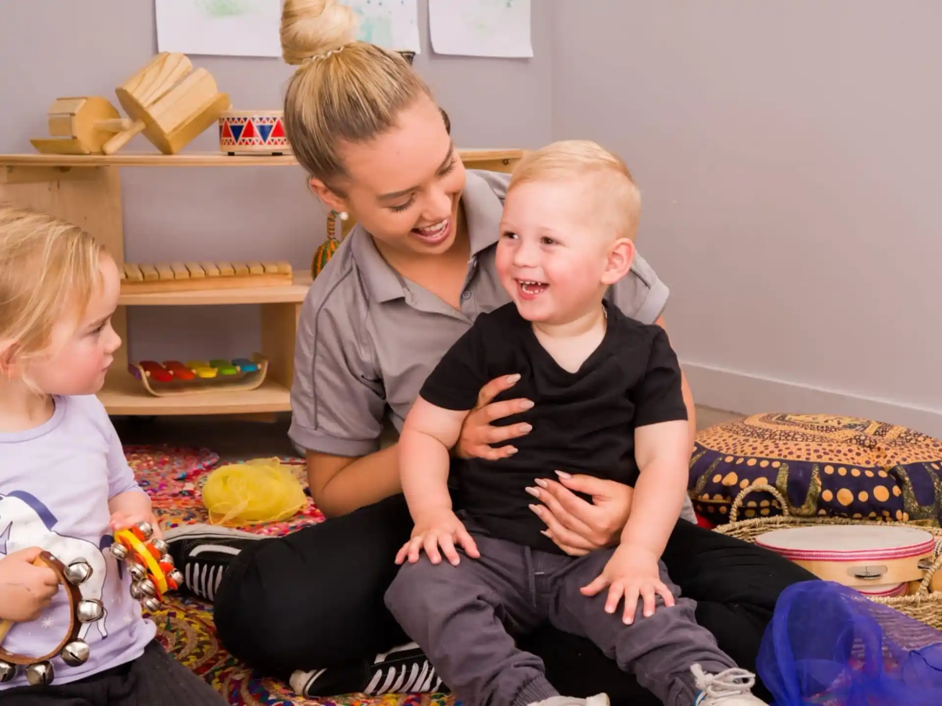 a person and two children sitting on a couch