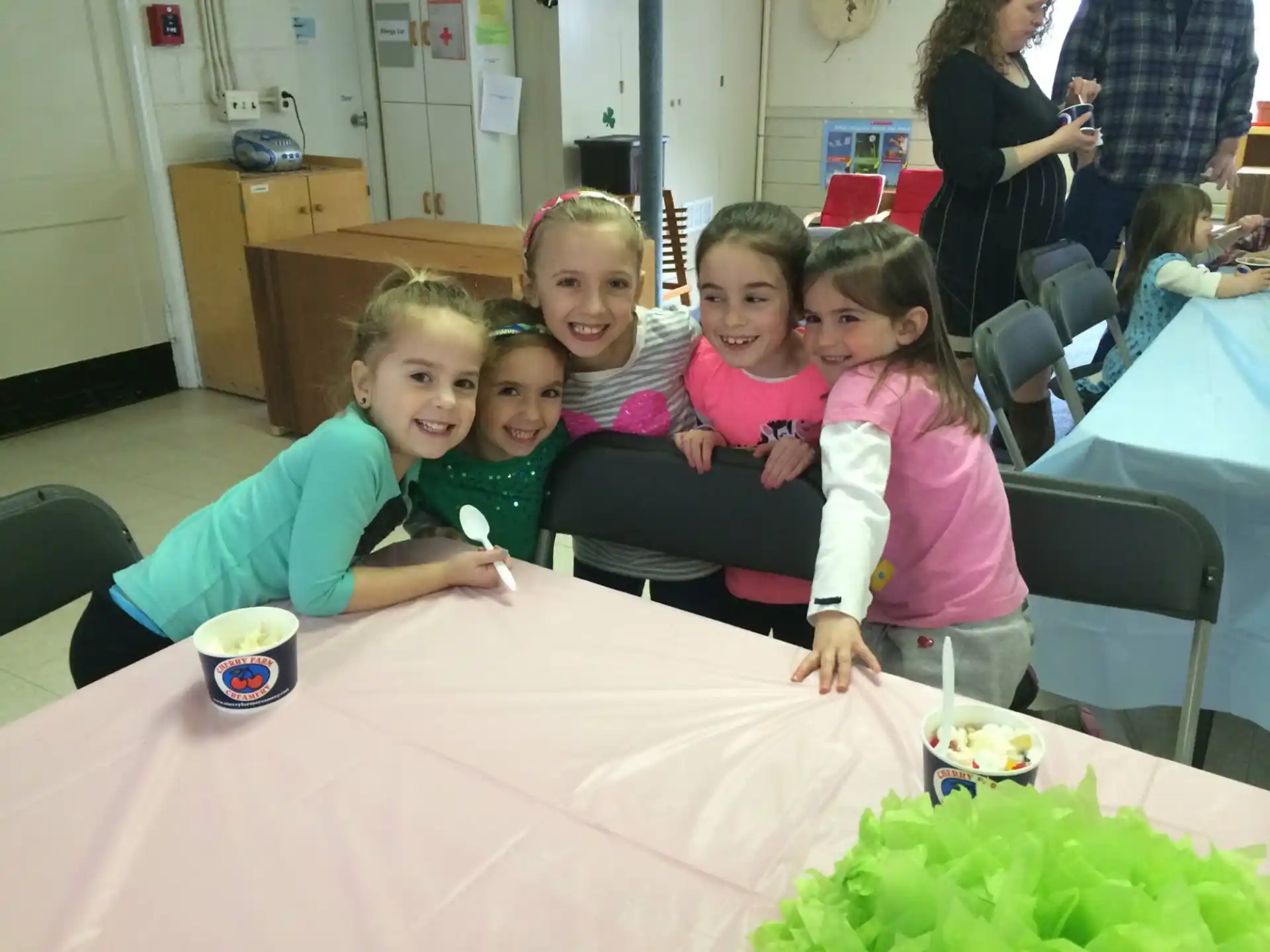 a group of children sitting at a table
