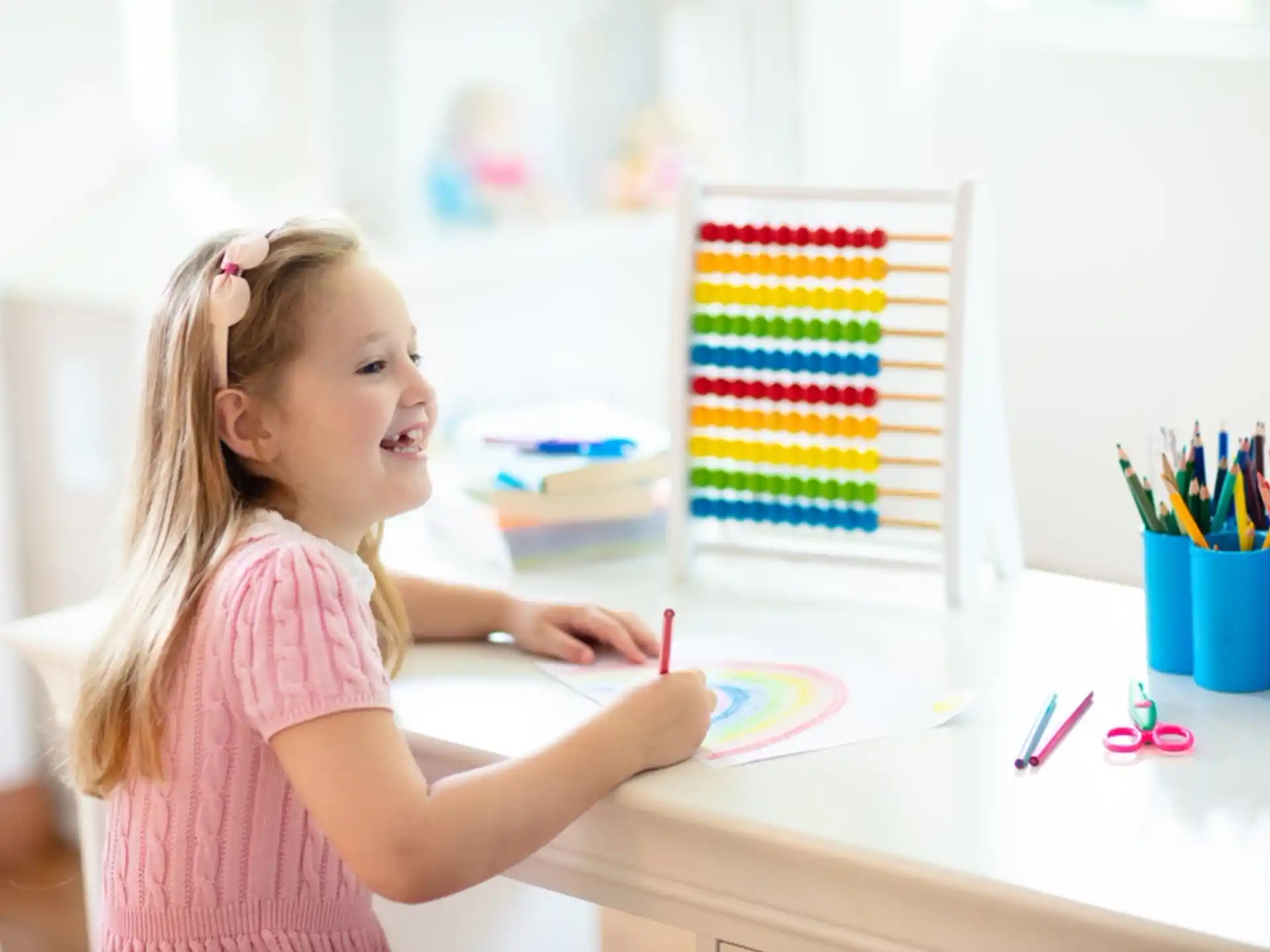 a girl coloring on a paper