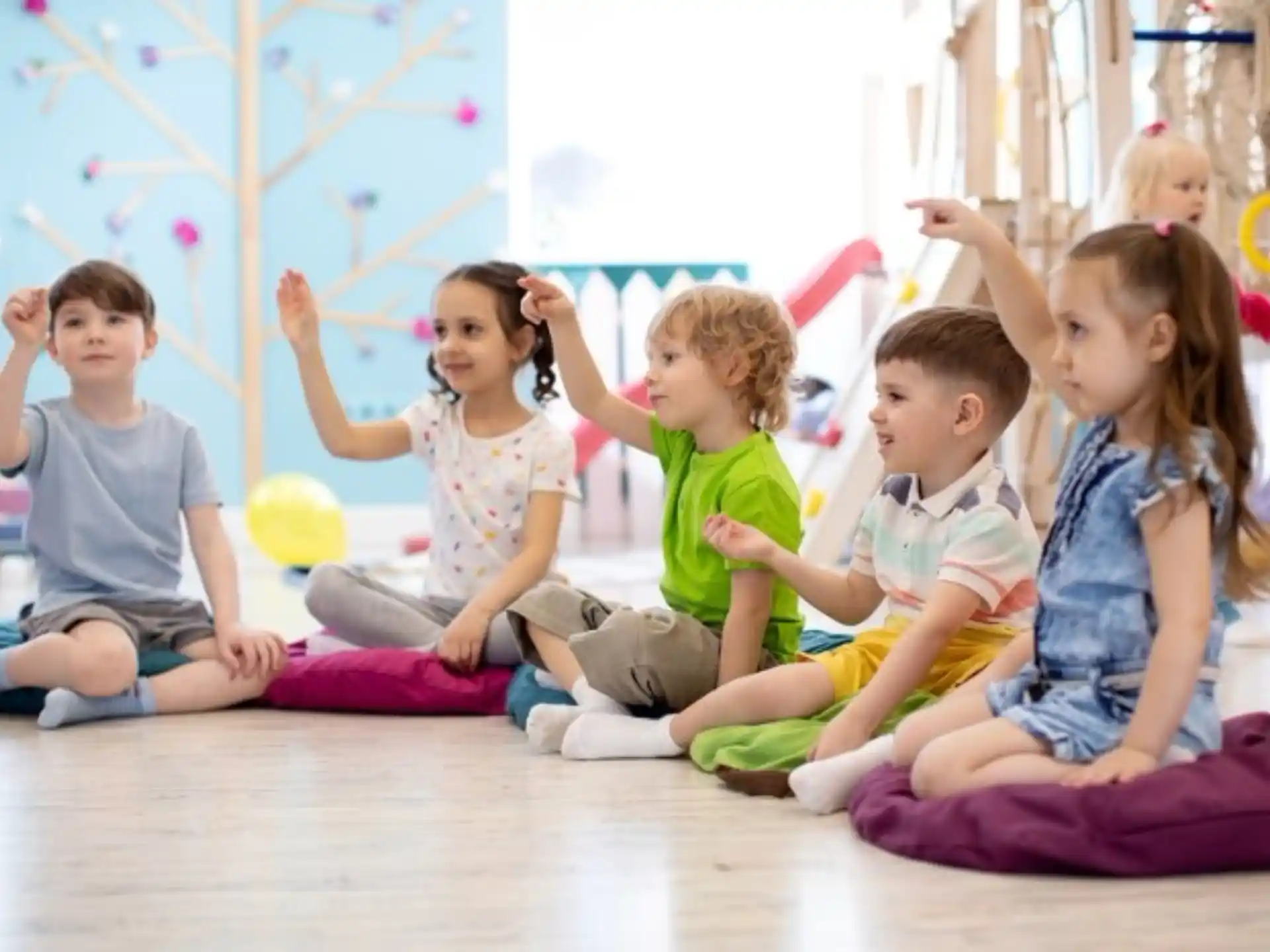 a group of children sitting on the floor