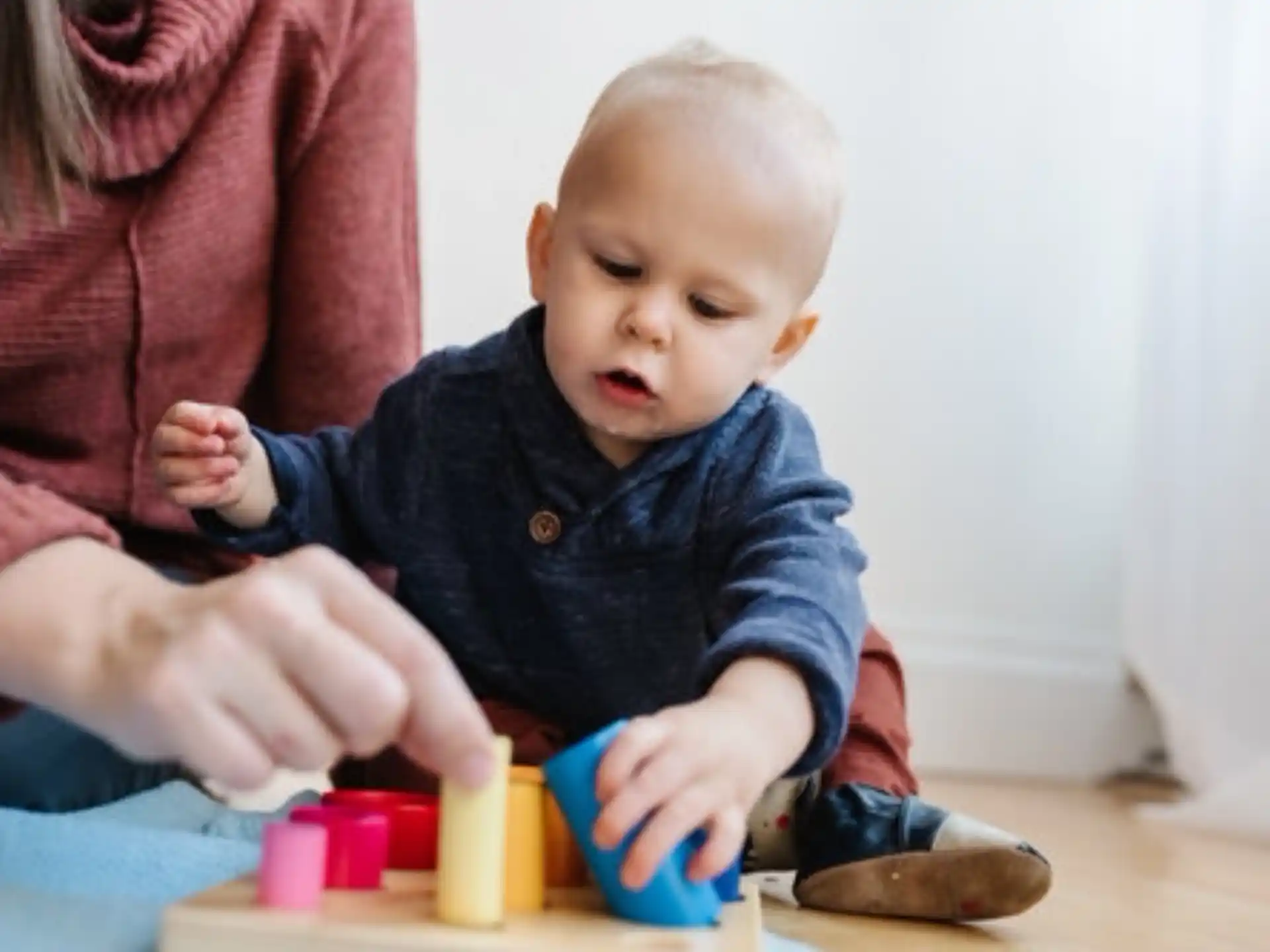 a baby playing with toys