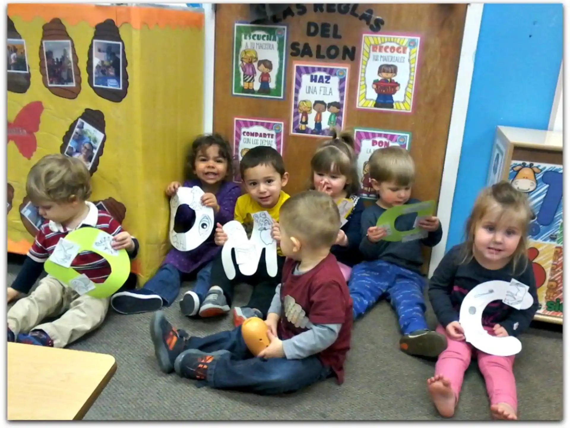 a group of children sitting on the floor