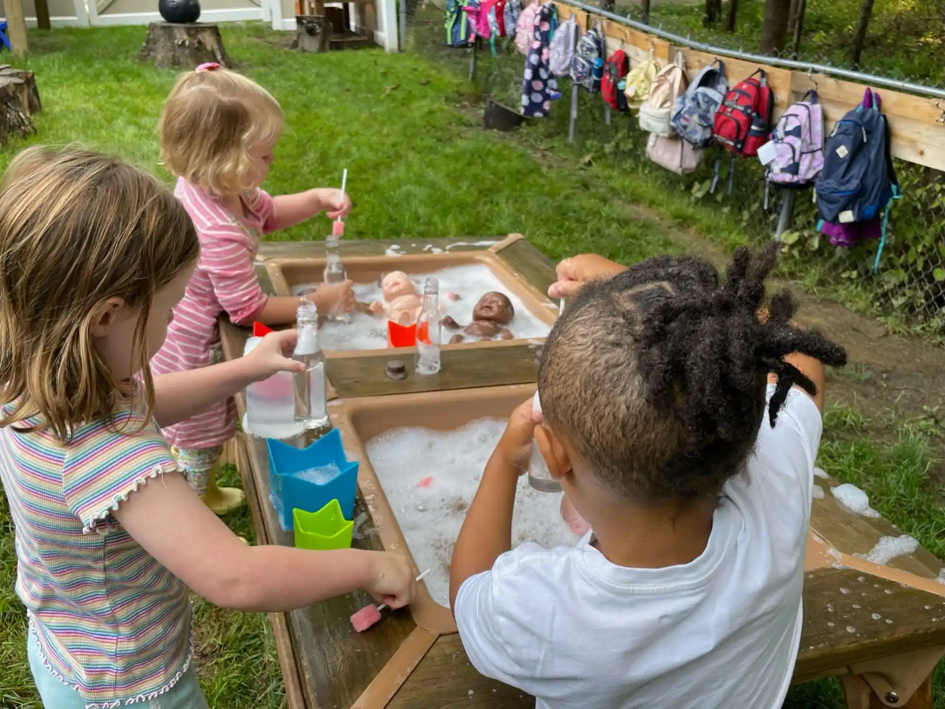 a group of children painting