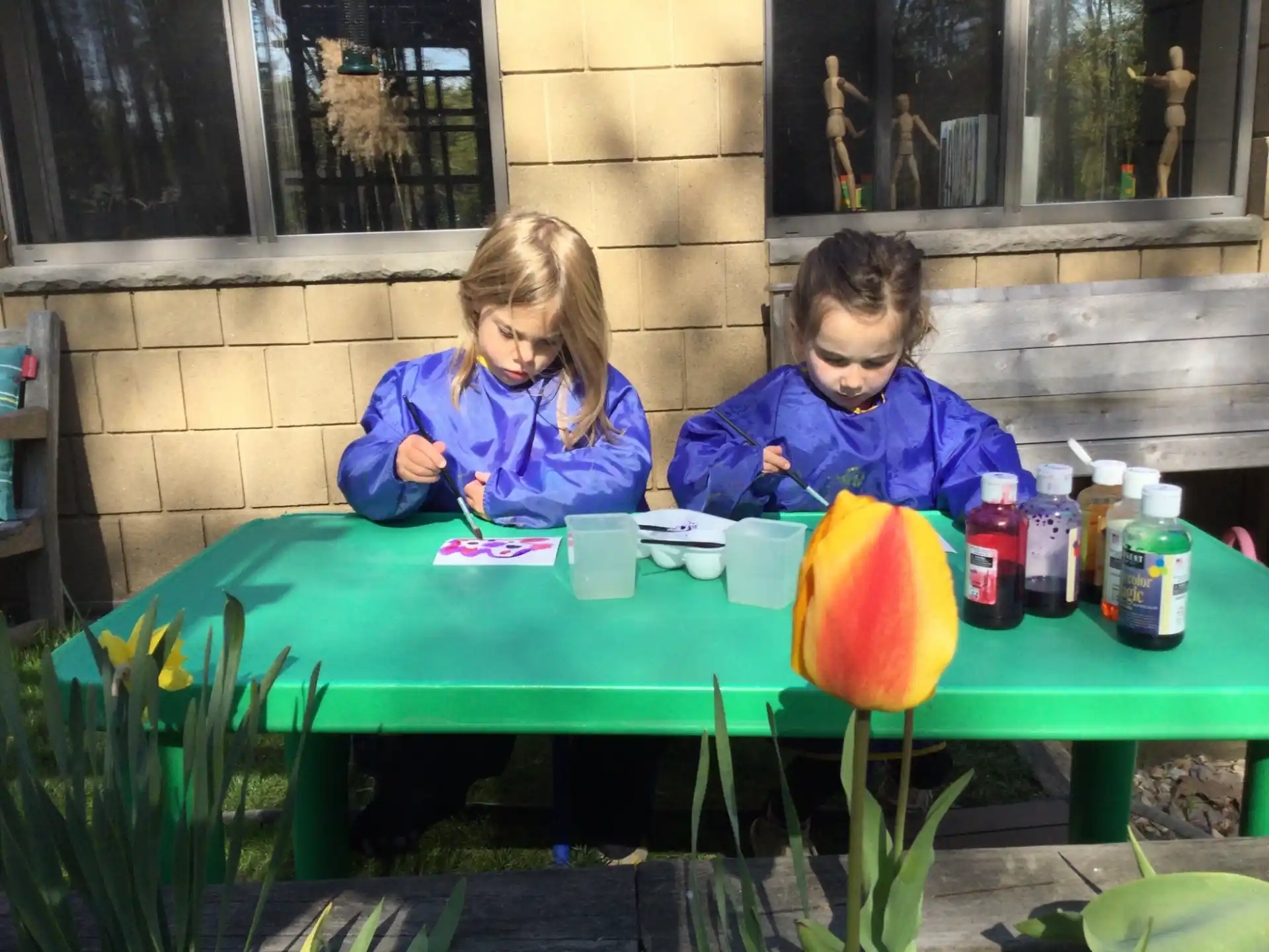 two girls sitting at a table