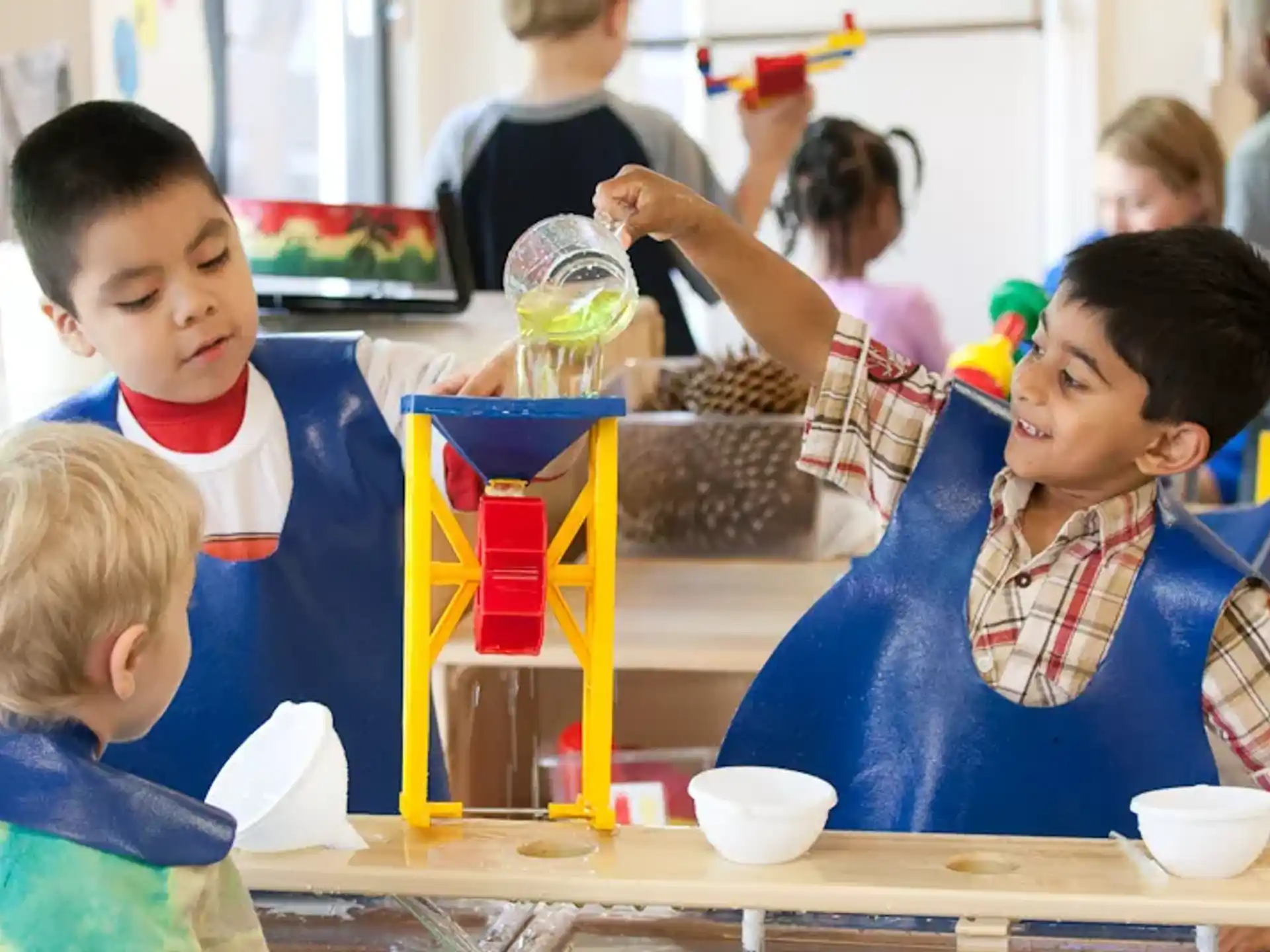 a group of children sitting at a table