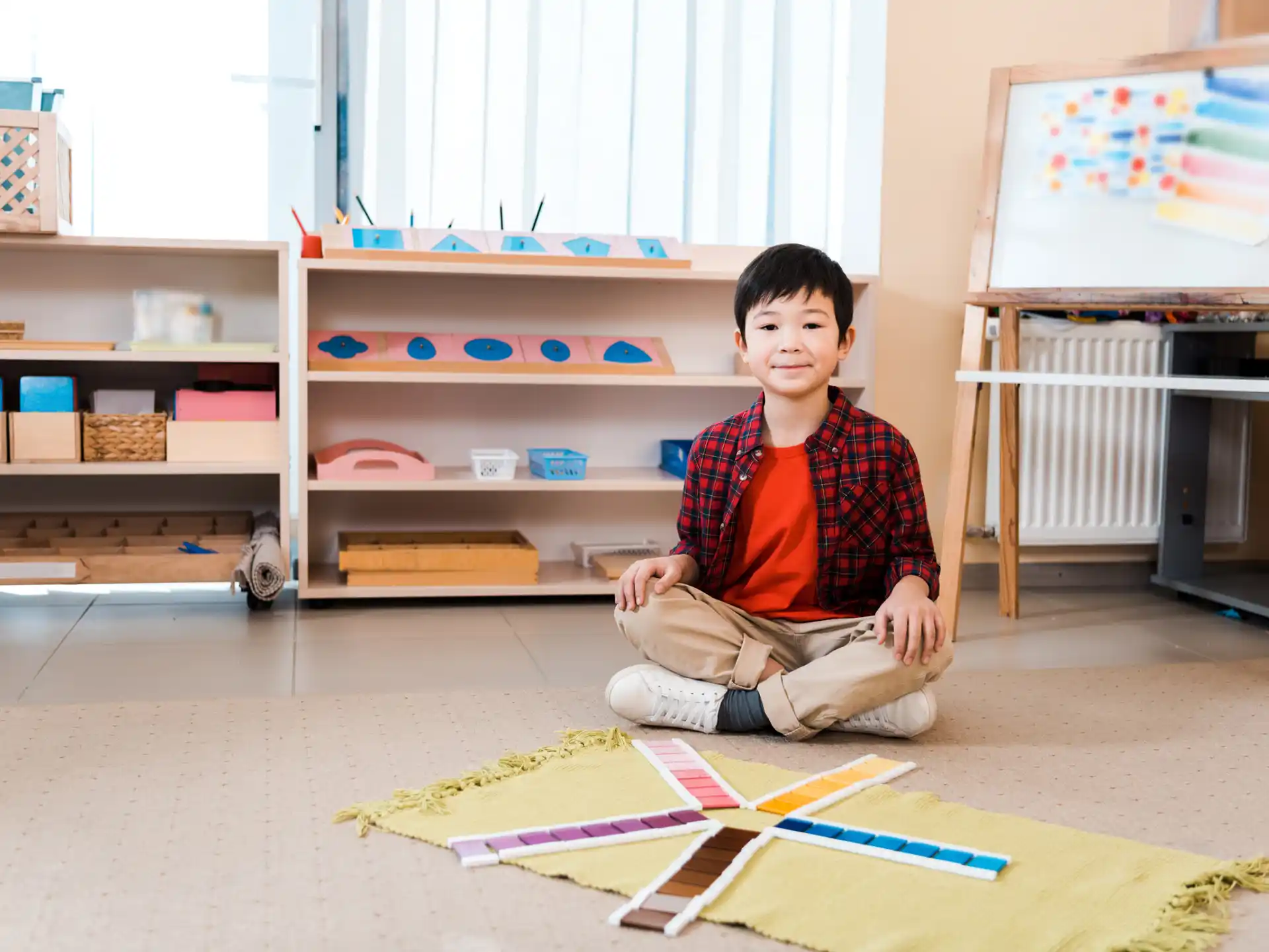 a boy sitting on the floor