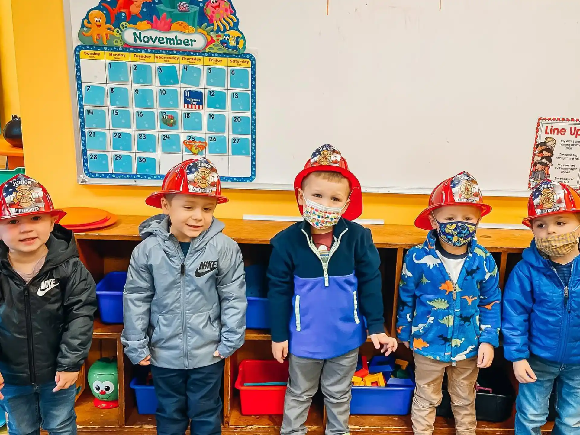 a group of children wearing helmets