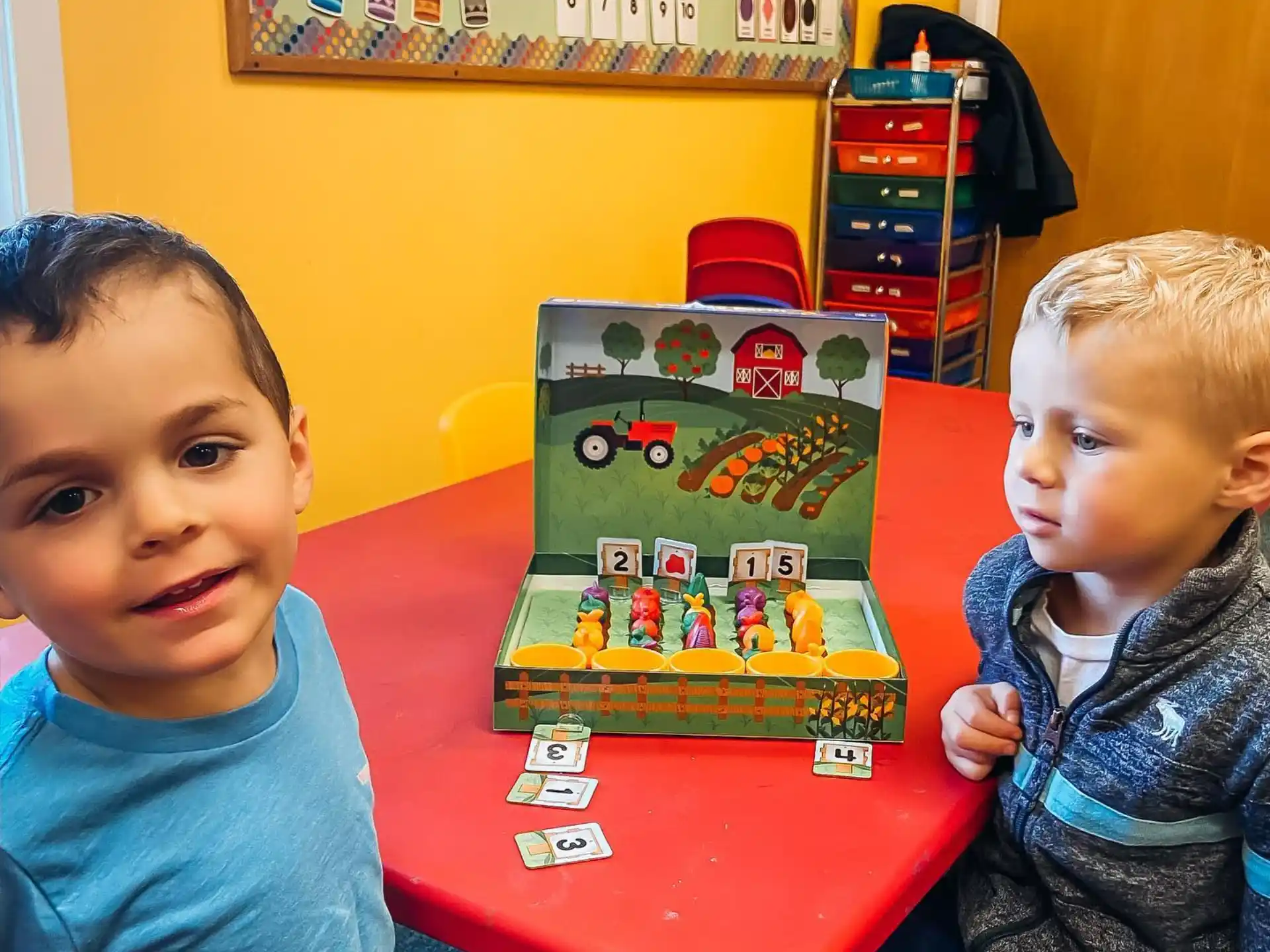 two children sitting at a table