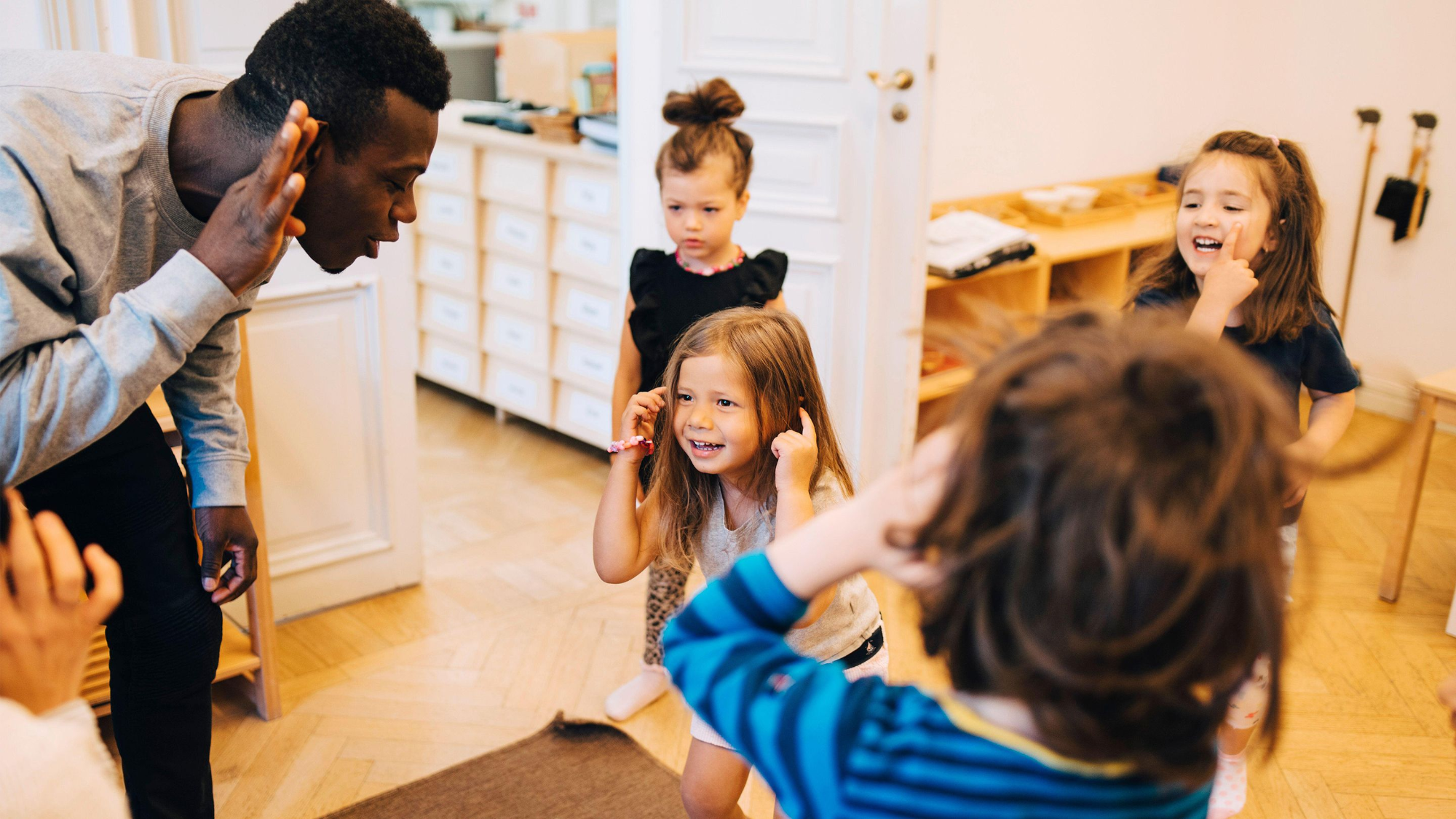 a group of people in a kitchen