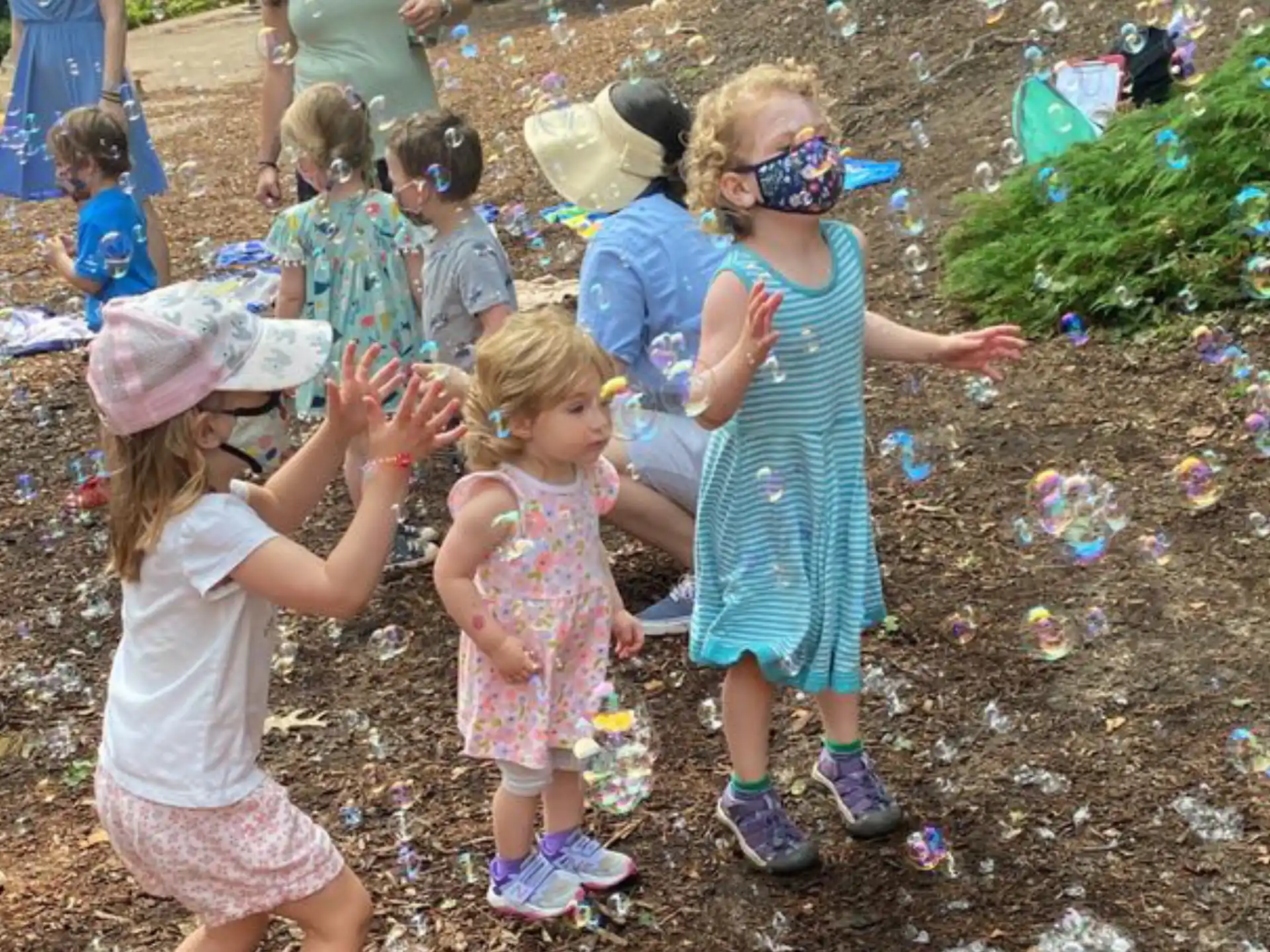 a group of children playing in the dirt