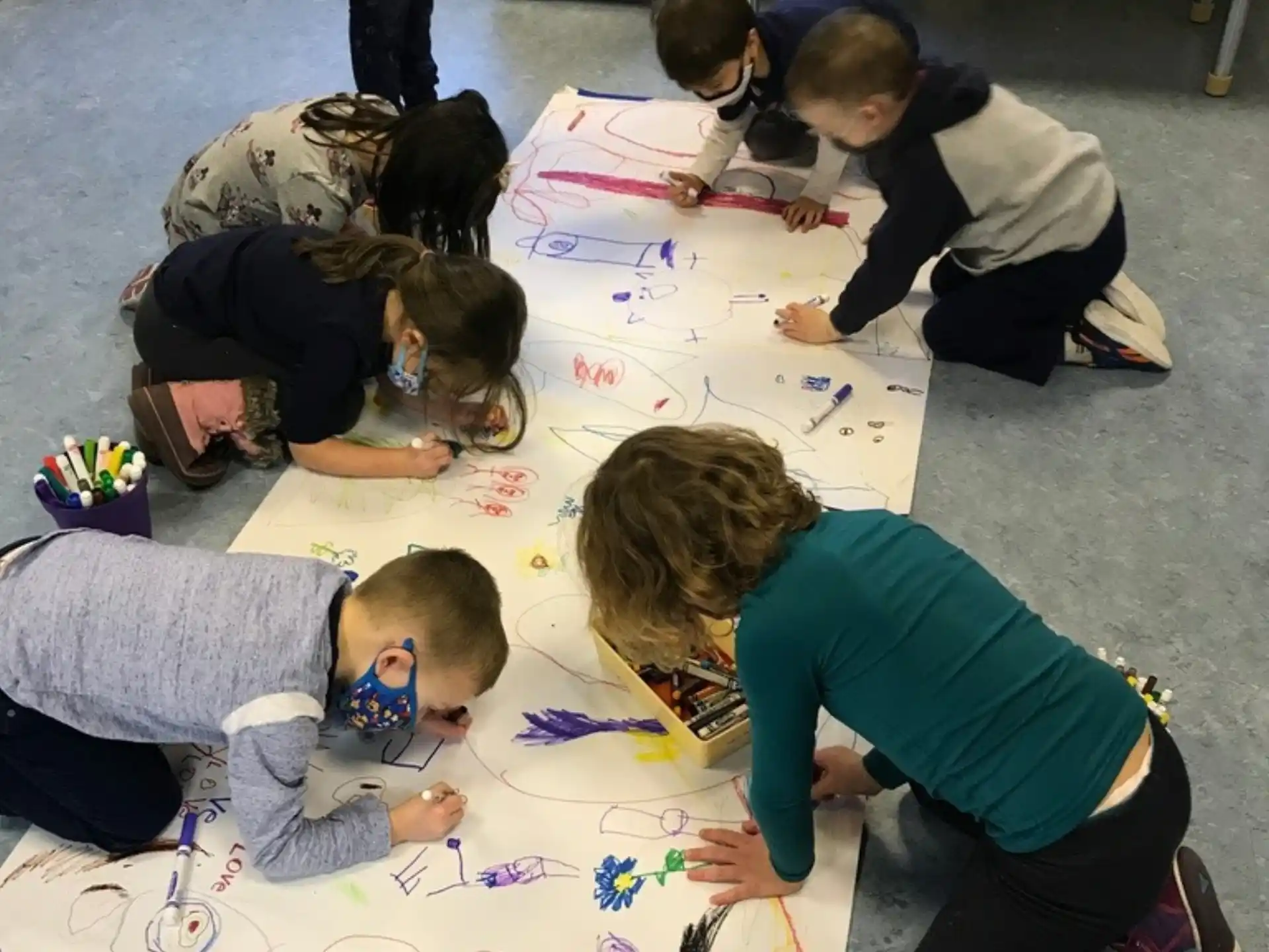 a group of people doing crafts