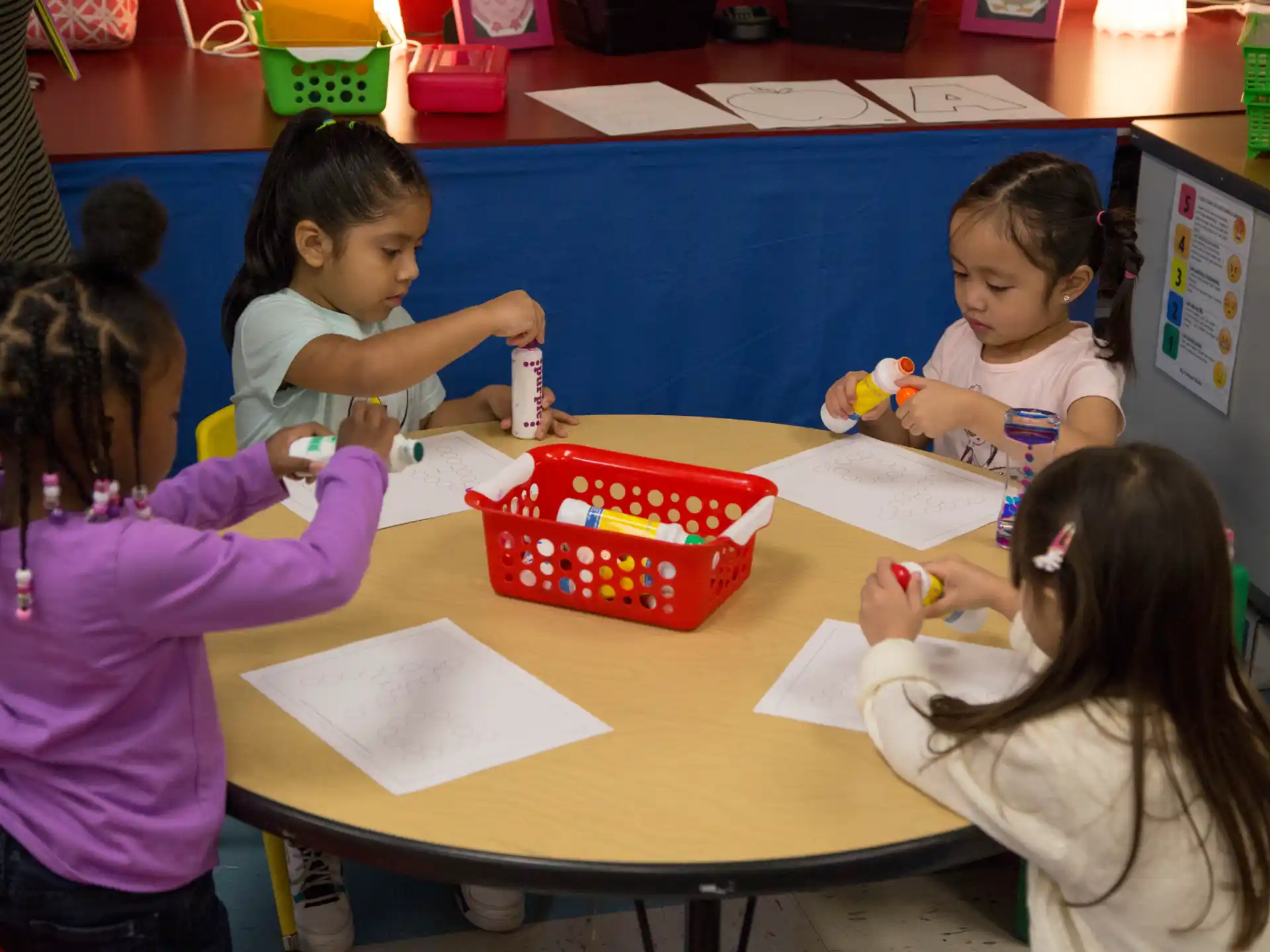 a group of children sitting at a table