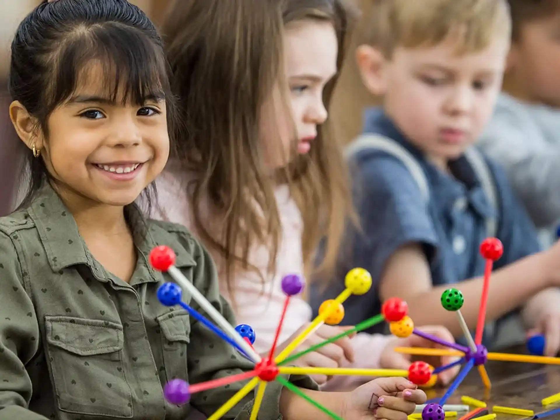 a group of children playing with toys
