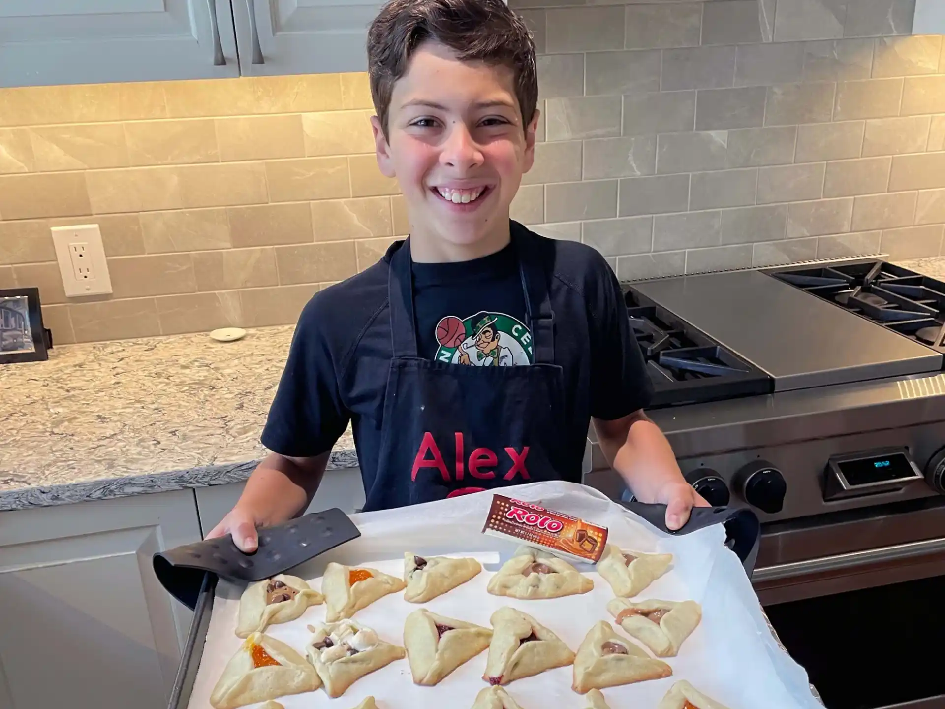 a boy holding a tray of food