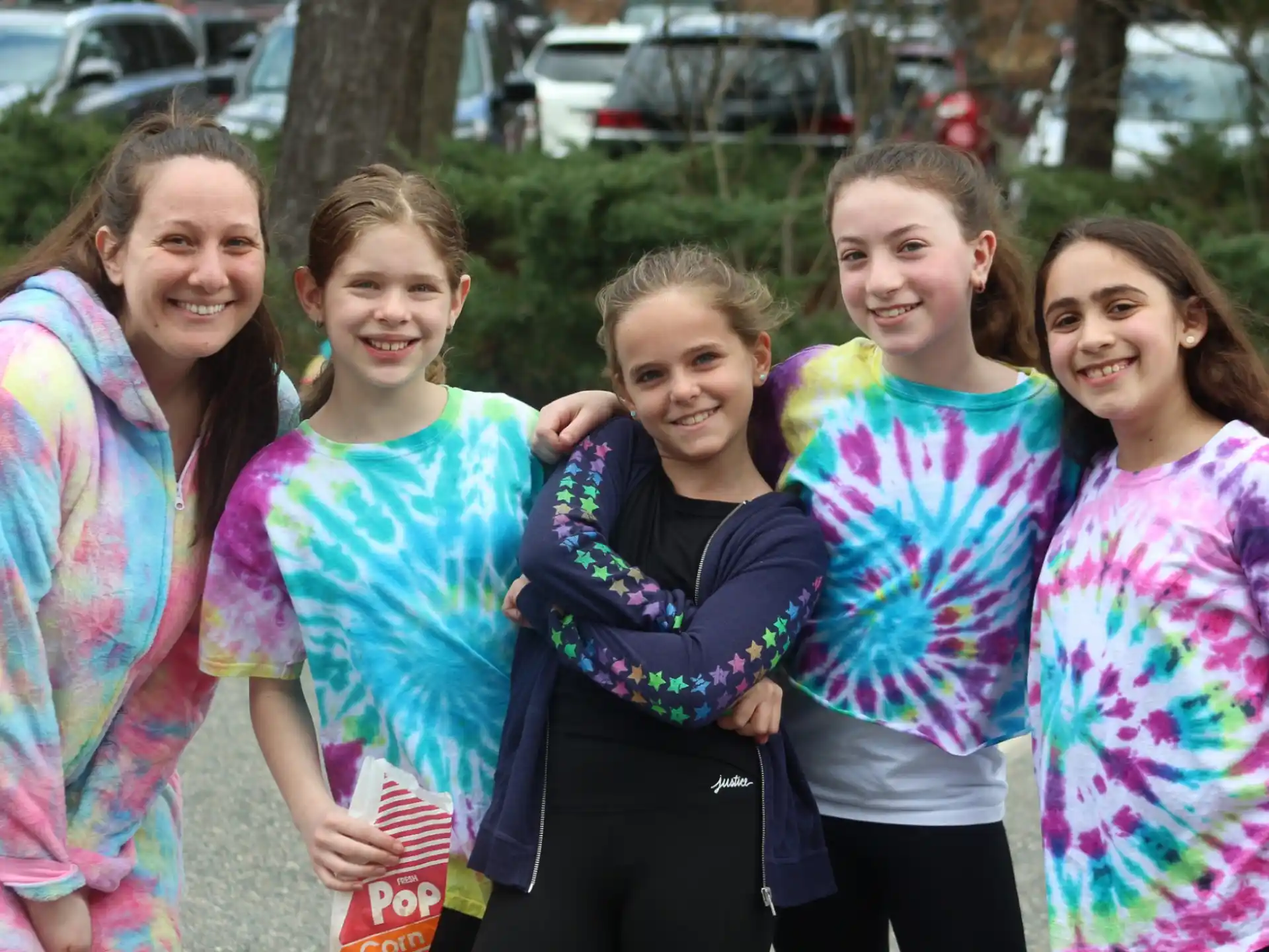 a group of girls smiling
