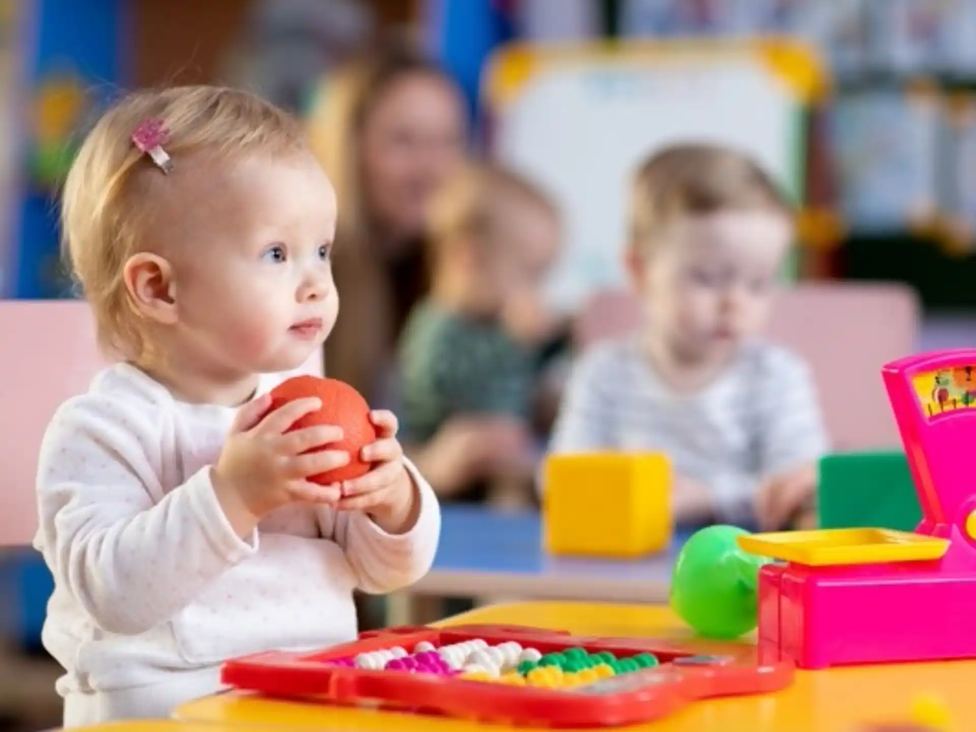 a baby playing with toys